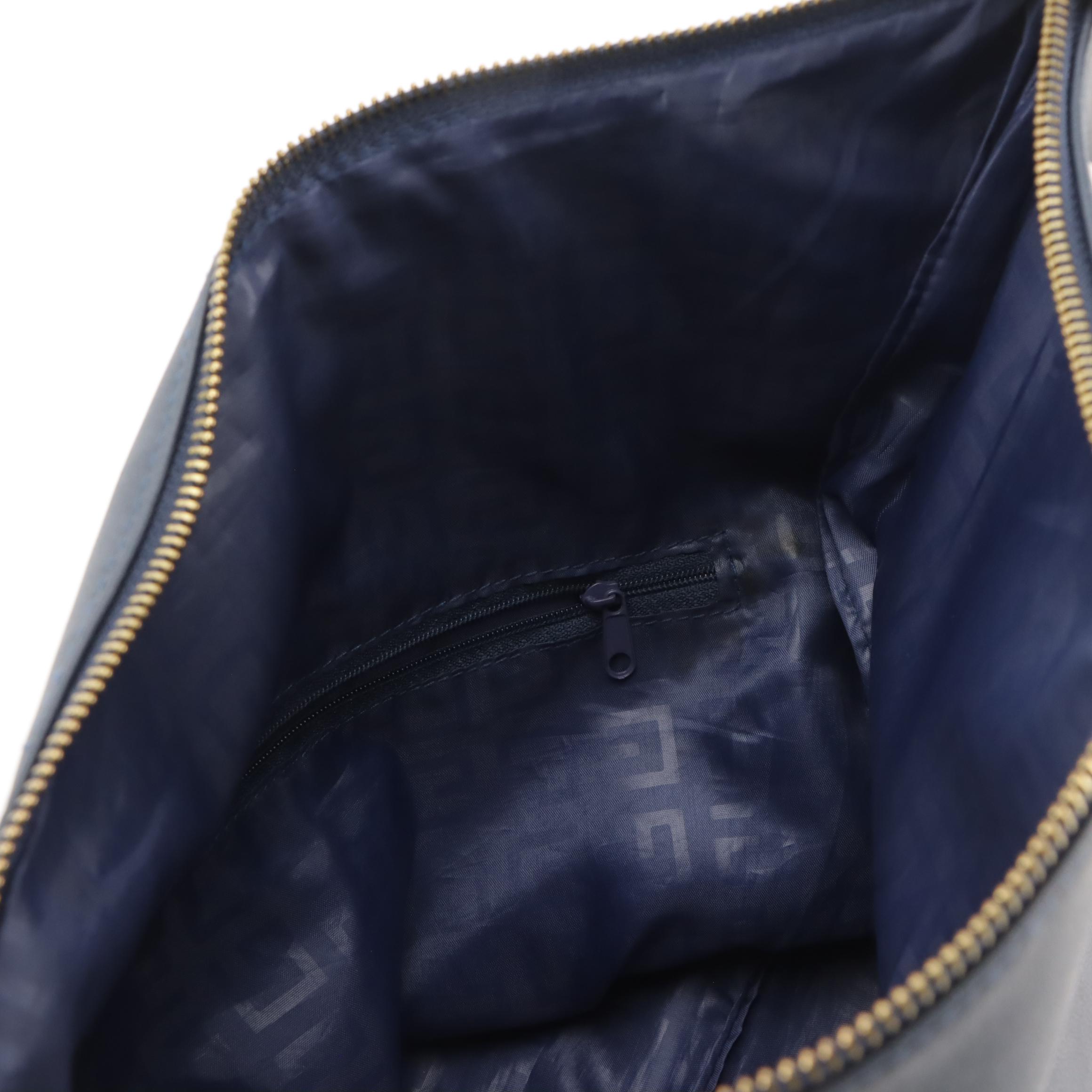 Givenchy Logo Embossed Fold Over Convertible Tassel Bag in Navy Vegan Leather