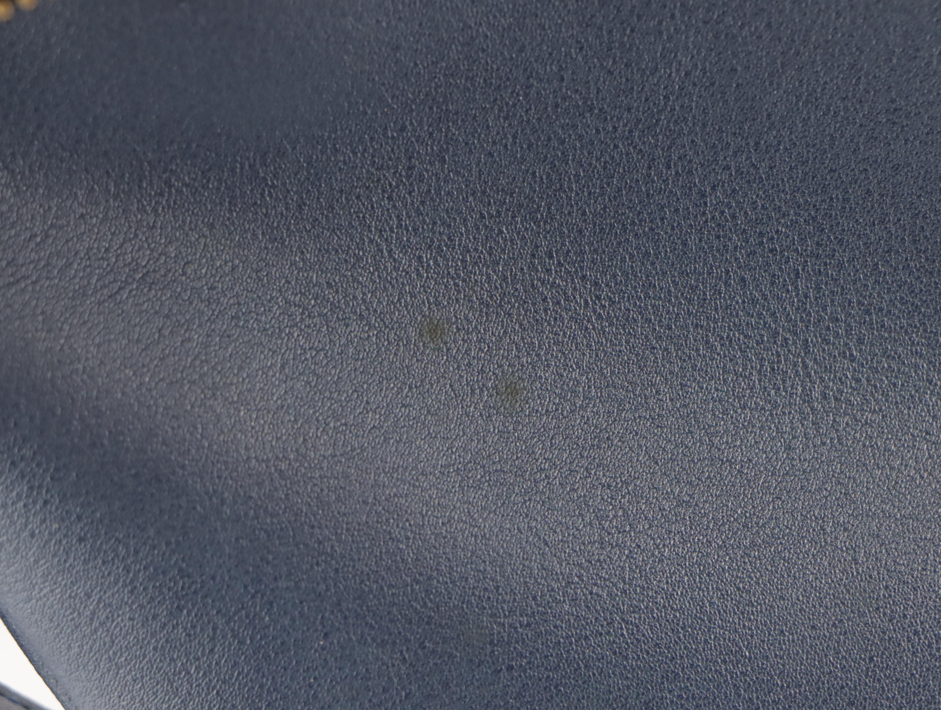 Givenchy Logo Embossed Fold Over Convertible Tassel Bag in Navy Vegan Leather