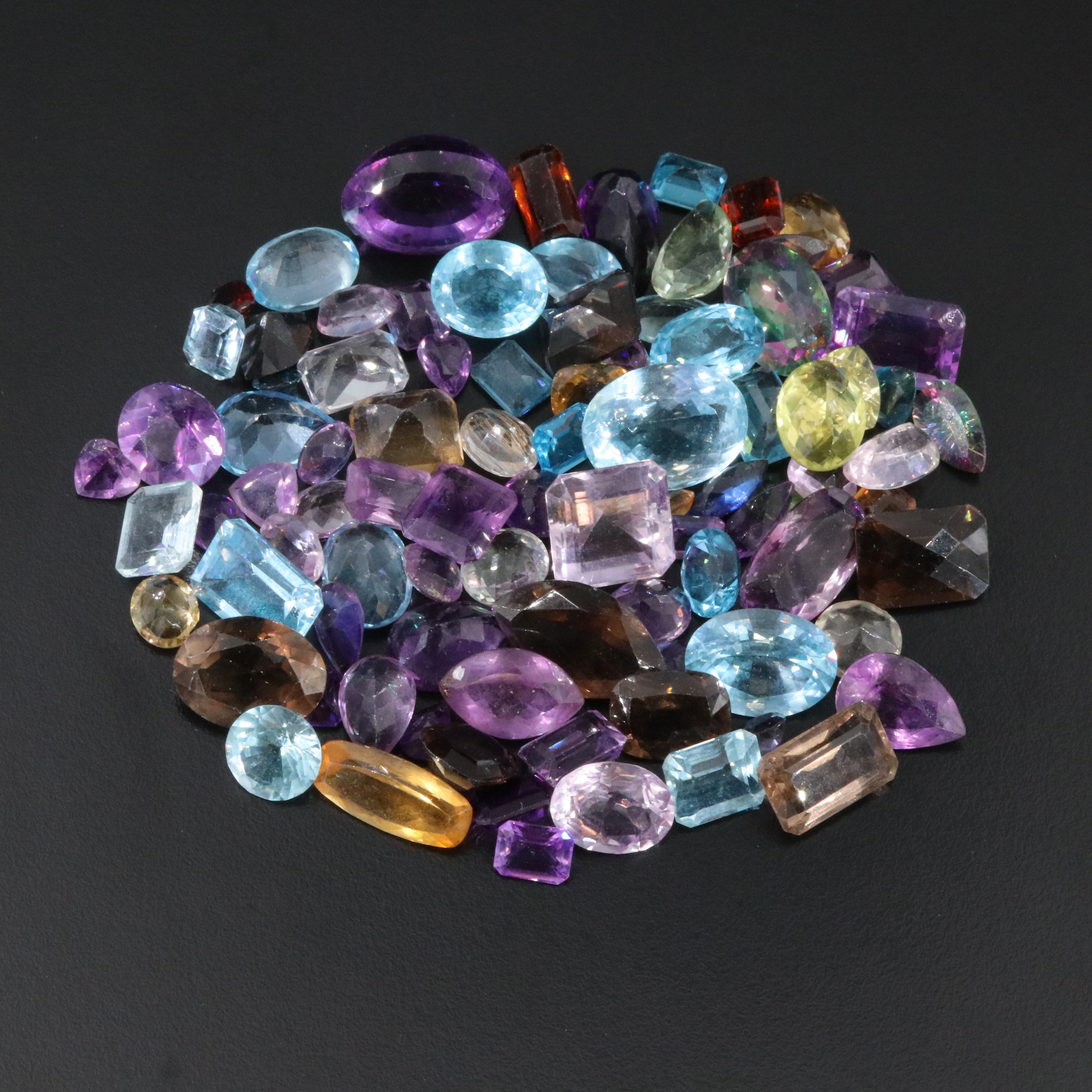Loose 711.00 CTW Gemstones Featuring Amethyst, Topaz and Citrine