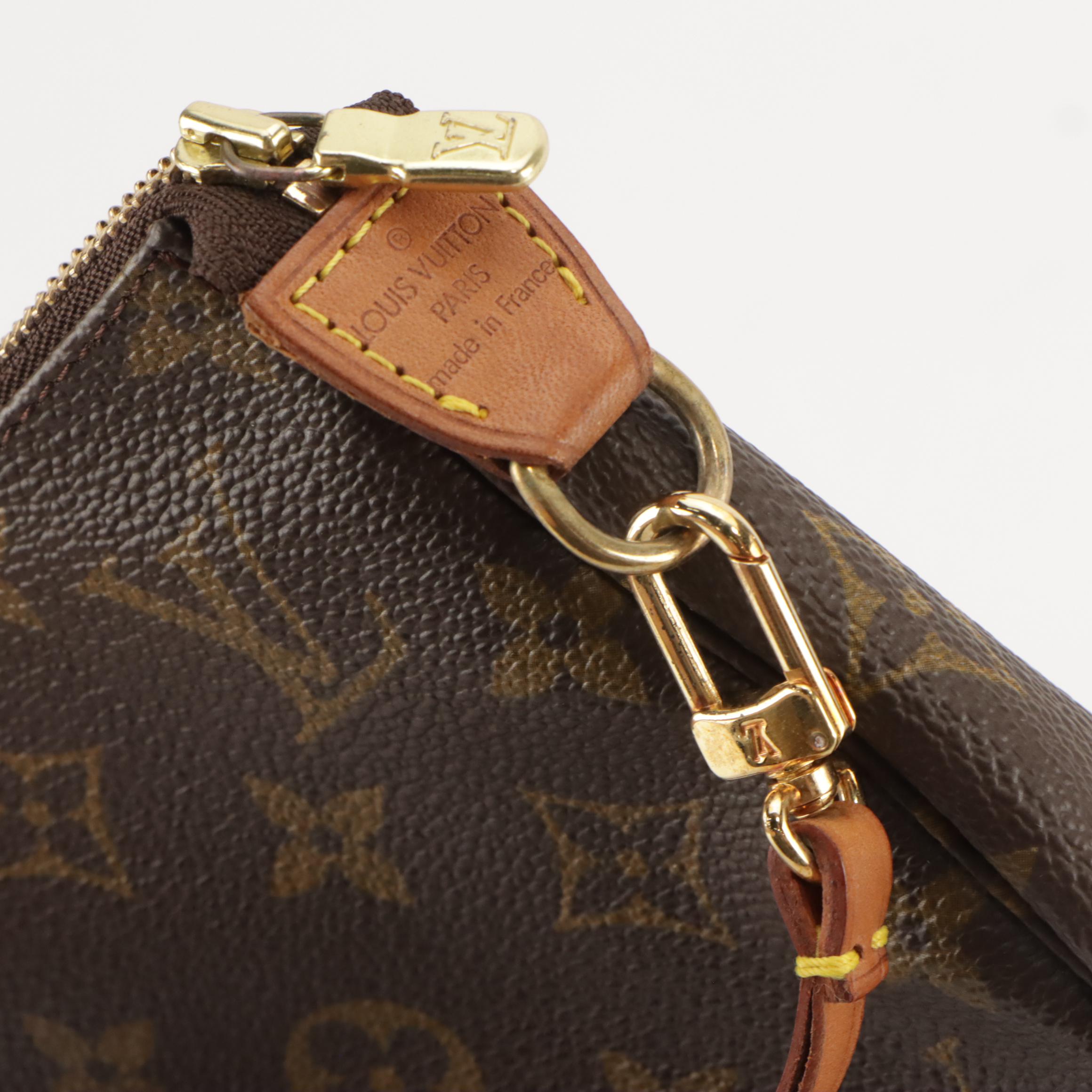 Louis Vuitton Zip Pochette in Monogram Canvas and Leather