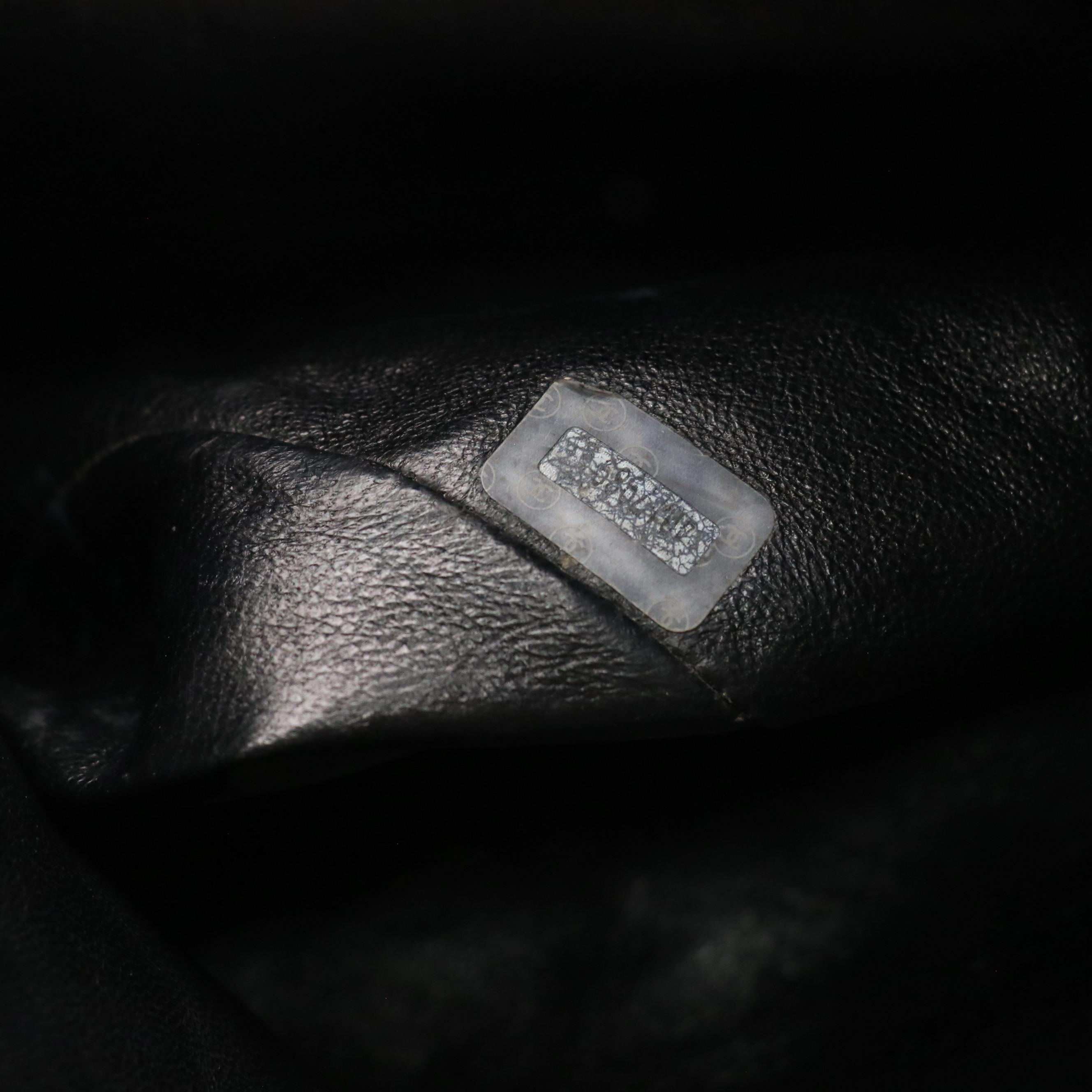 Chanel CC Drawstring Chain Strap Backpack in Black Quilted Leather