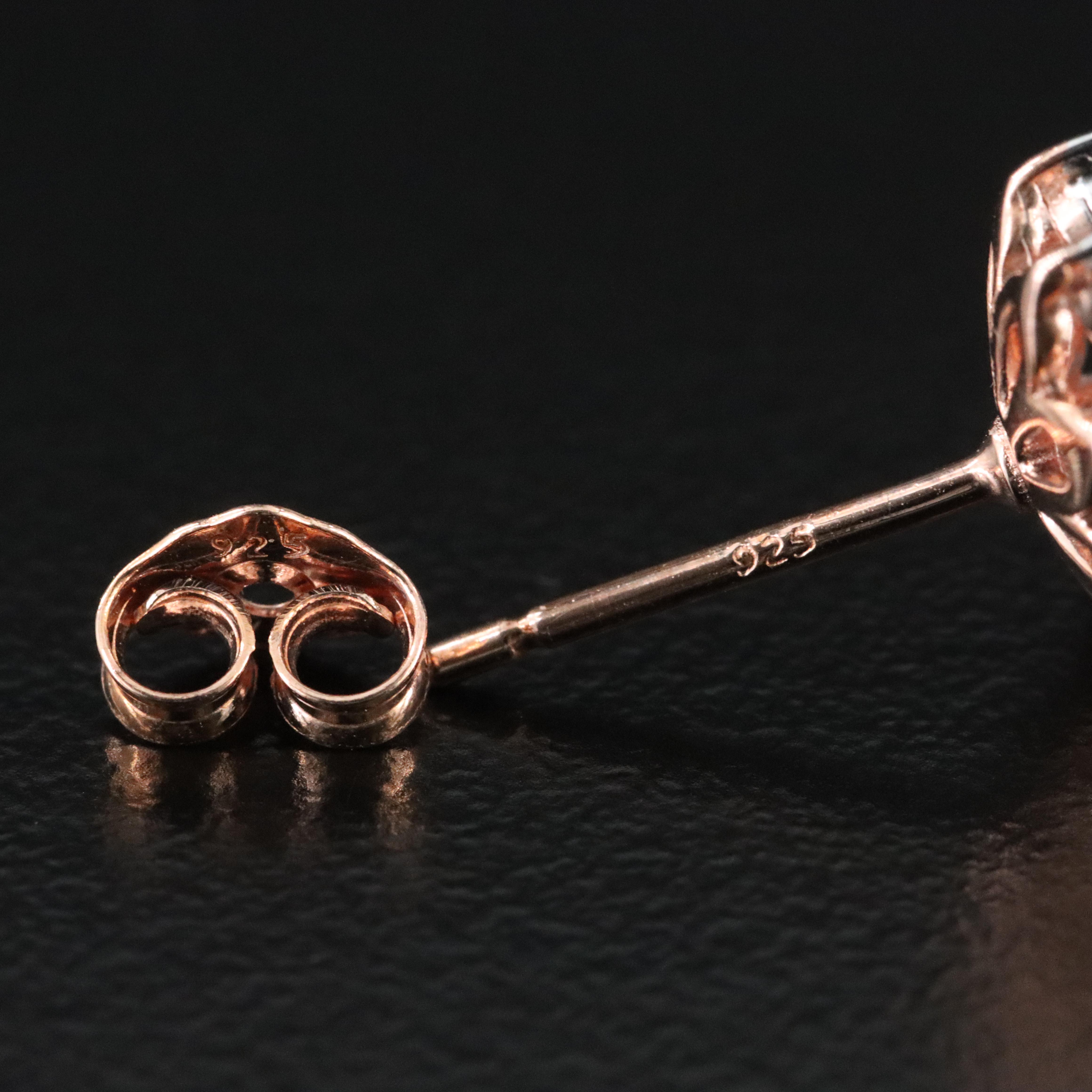 Sterling Sky Blue Topaz and Diamond Stud Earrings