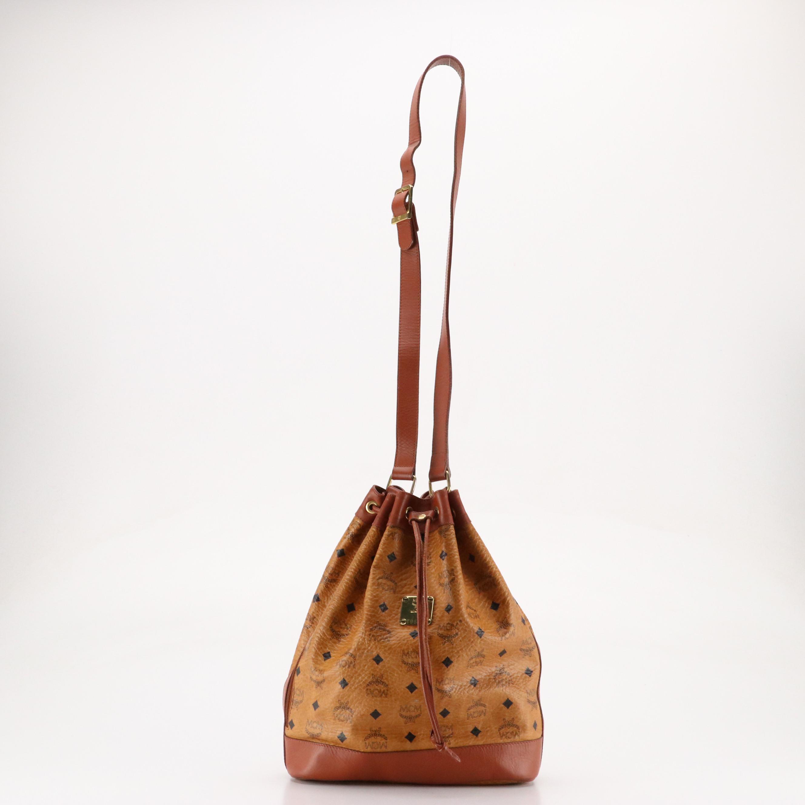 MCM Golf Collection Drawstring Bucket Bag in Cognac Visetos Canvas and Leather