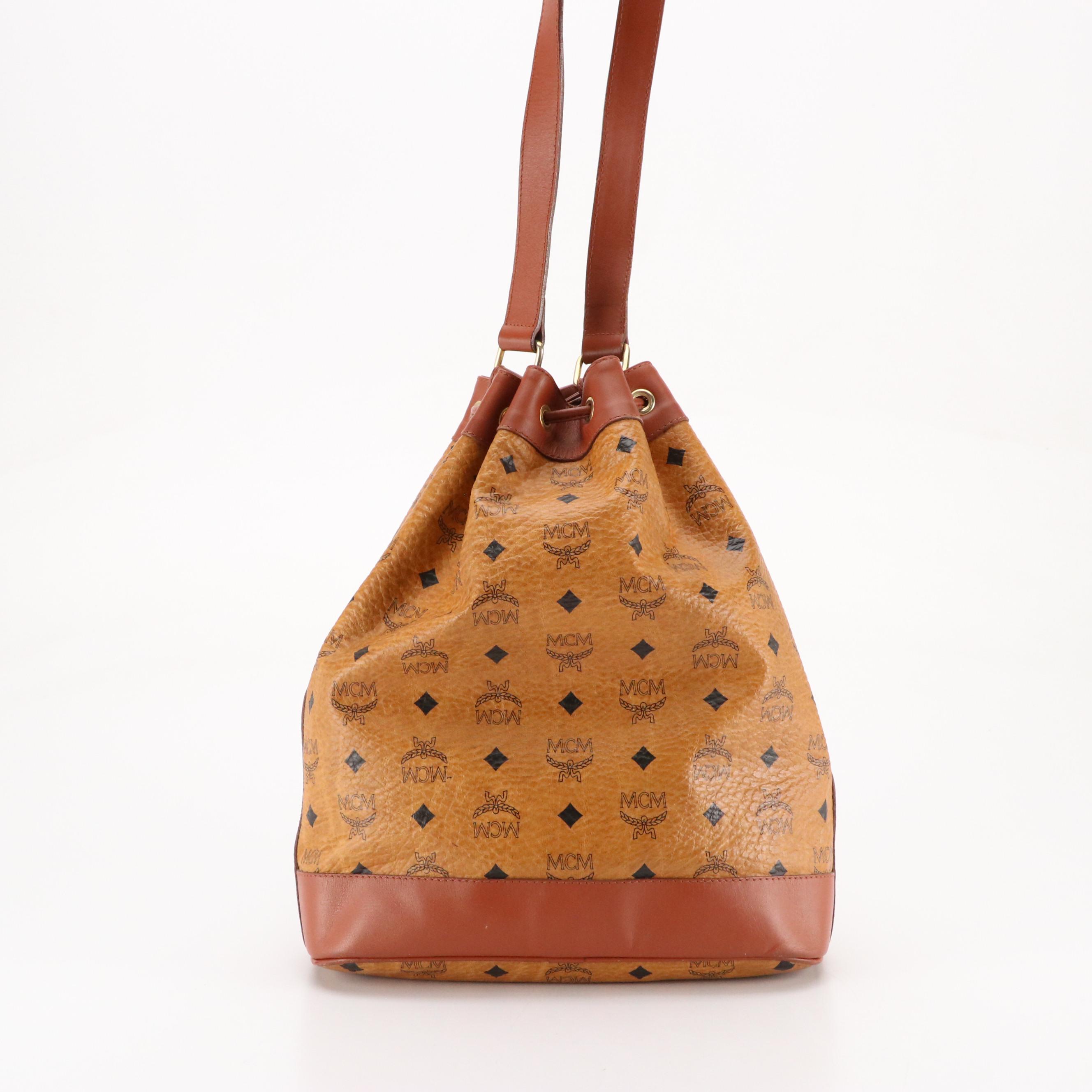 MCM Golf Collection Drawstring Bucket Bag in Cognac Visetos Canvas and Leather