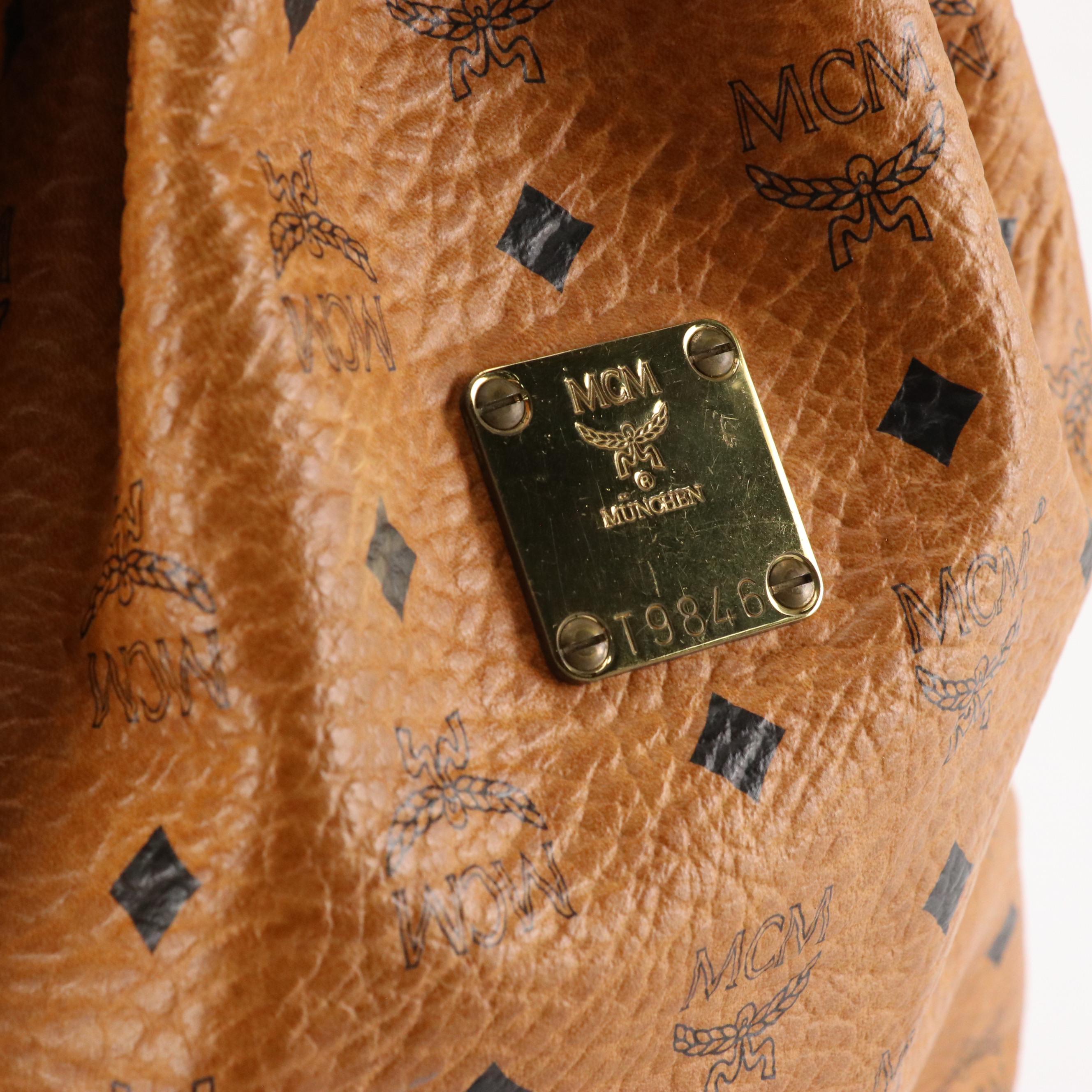 MCM Golf Collection Drawstring Bucket Bag in Cognac Visetos Canvas and Leather