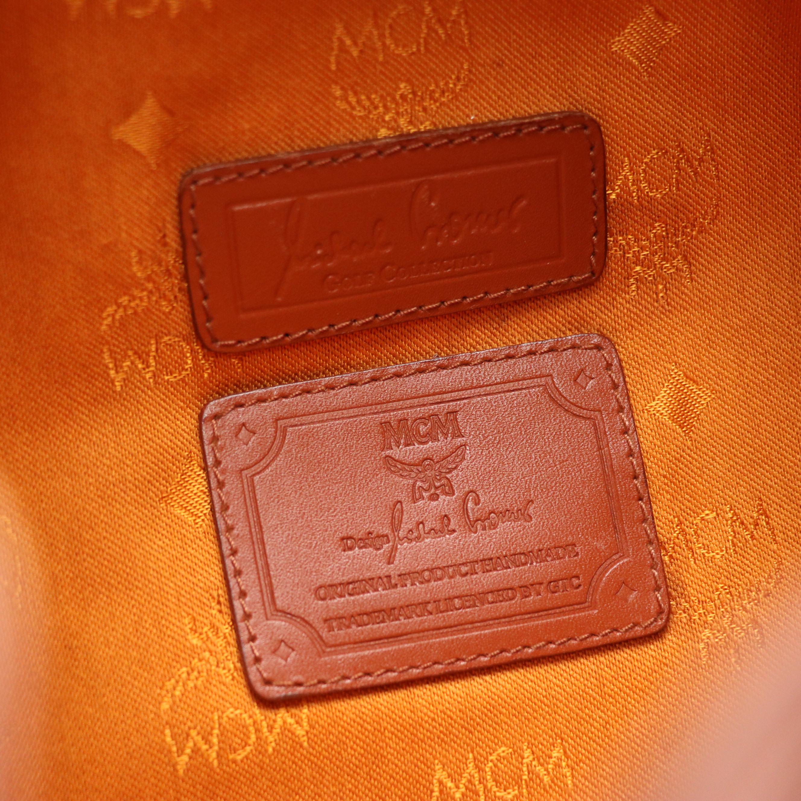 MCM Golf Collection Drawstring Bucket Bag in Cognac Visetos Canvas and Leather