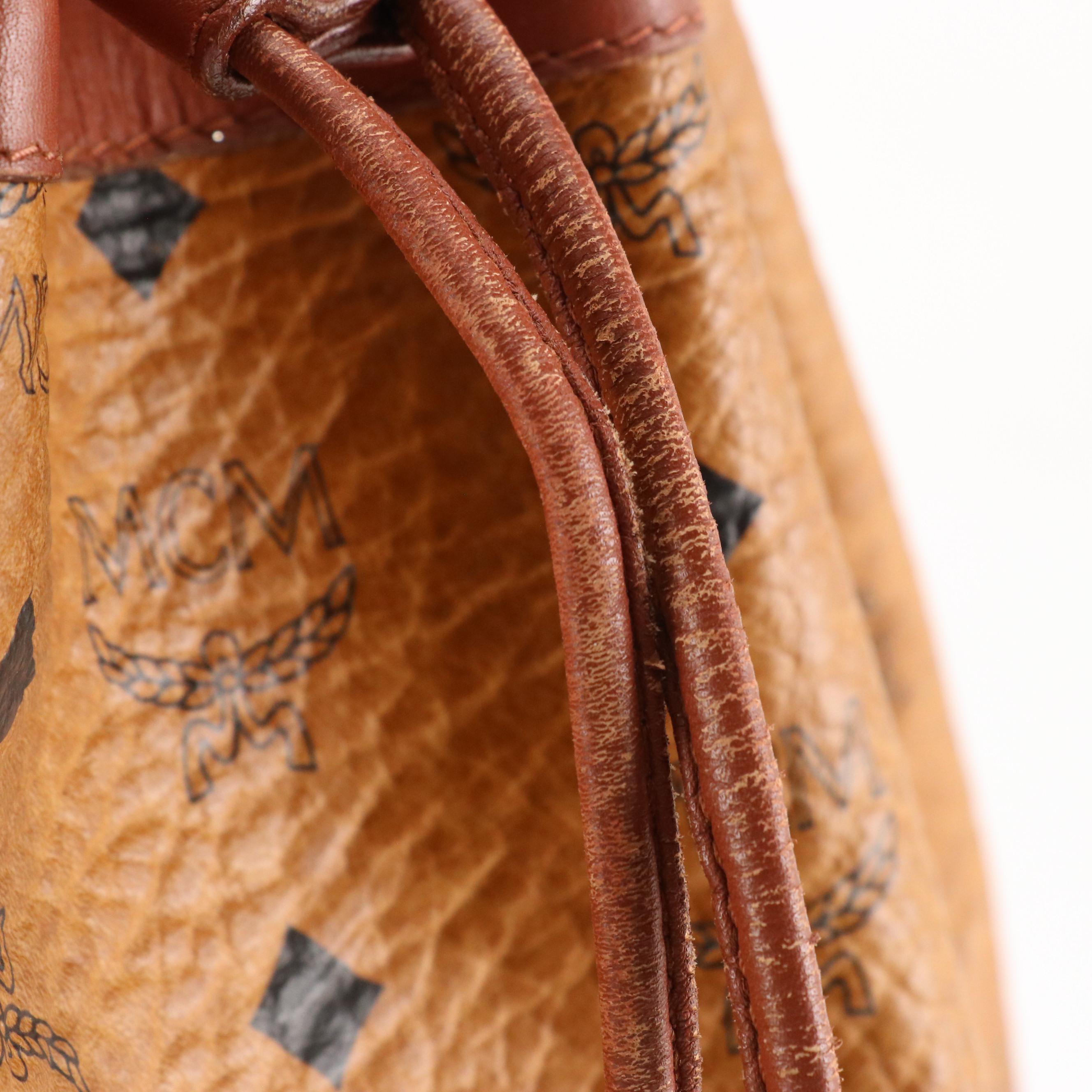 MCM Golf Collection Drawstring Bucket Bag in Cognac Visetos Canvas and Leather