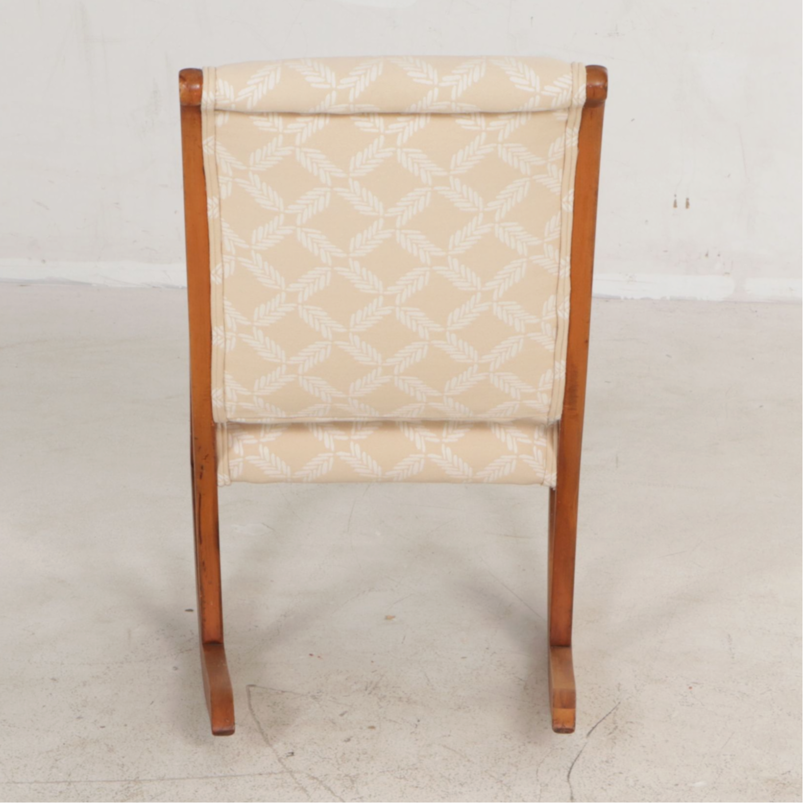 Oak Armless Sewing Rocker Features Woven Feather Motif Upholstry