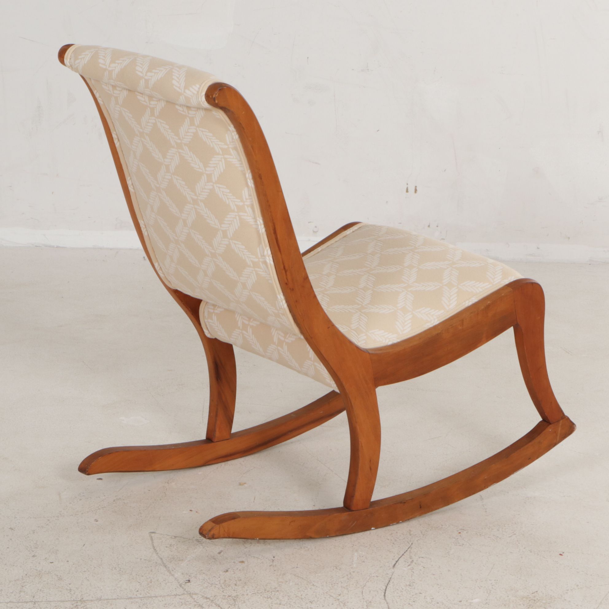 Oak Armless Sewing Rocker Features Woven Feather Motif Upholstry