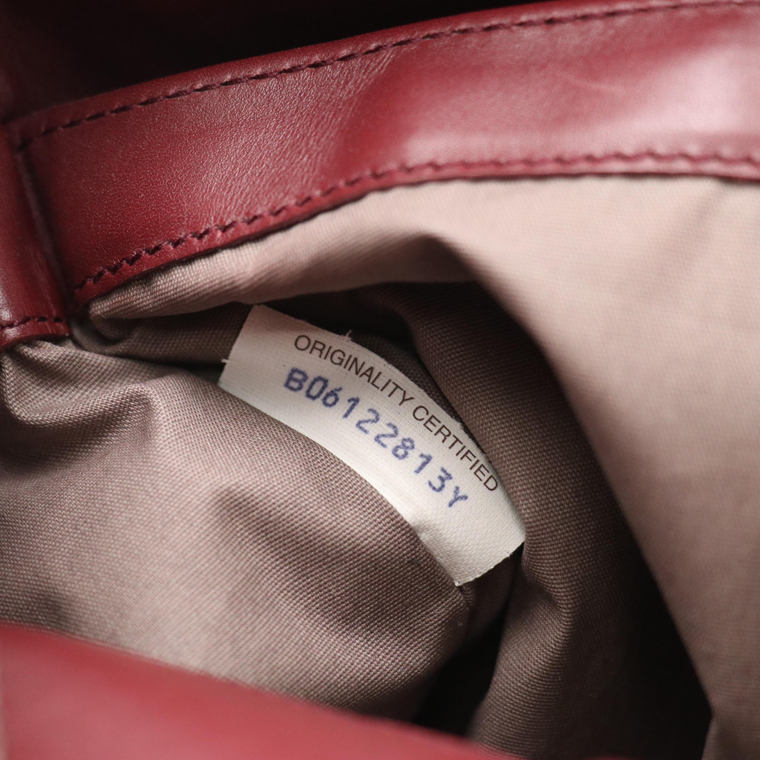 Bottega Veneta Zippered Clutch Bag in Merlot Red Intrecciato Leather