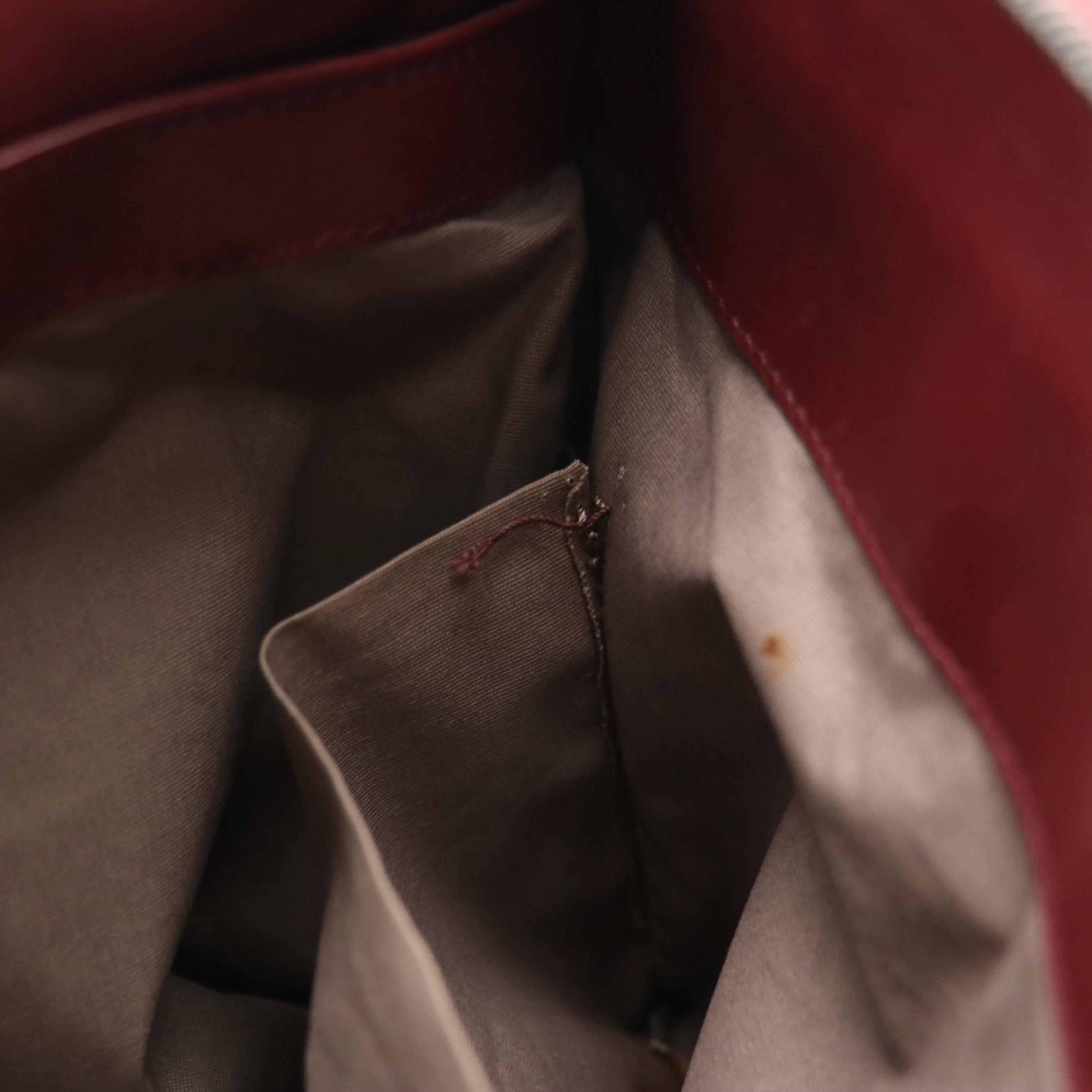 Bottega Veneta Zippered Clutch Bag in Merlot Red Intrecciato Leather