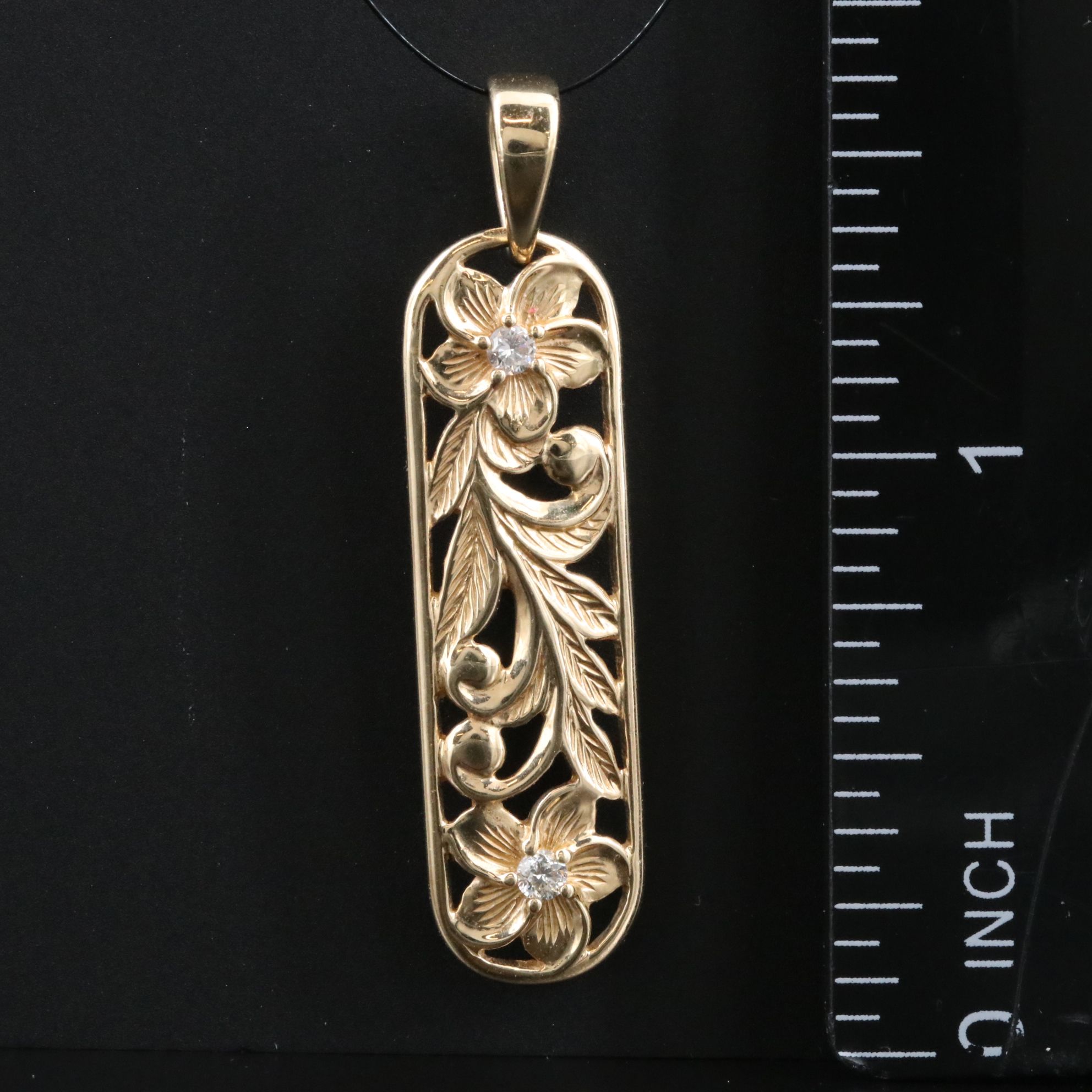 14K 0.08 CTW Diamond Floral Pendant