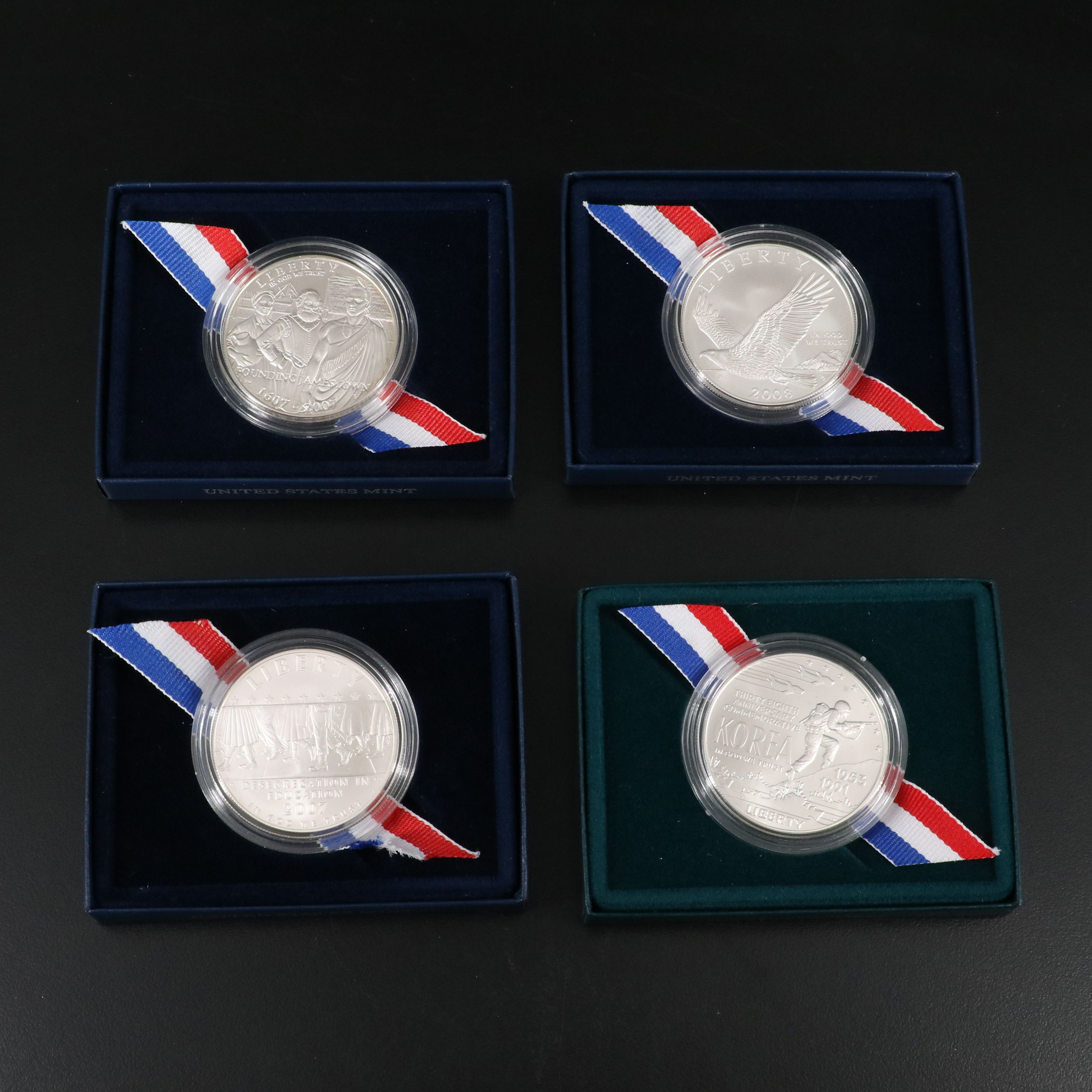 Four Different Modern Commemorative Silver Dollars