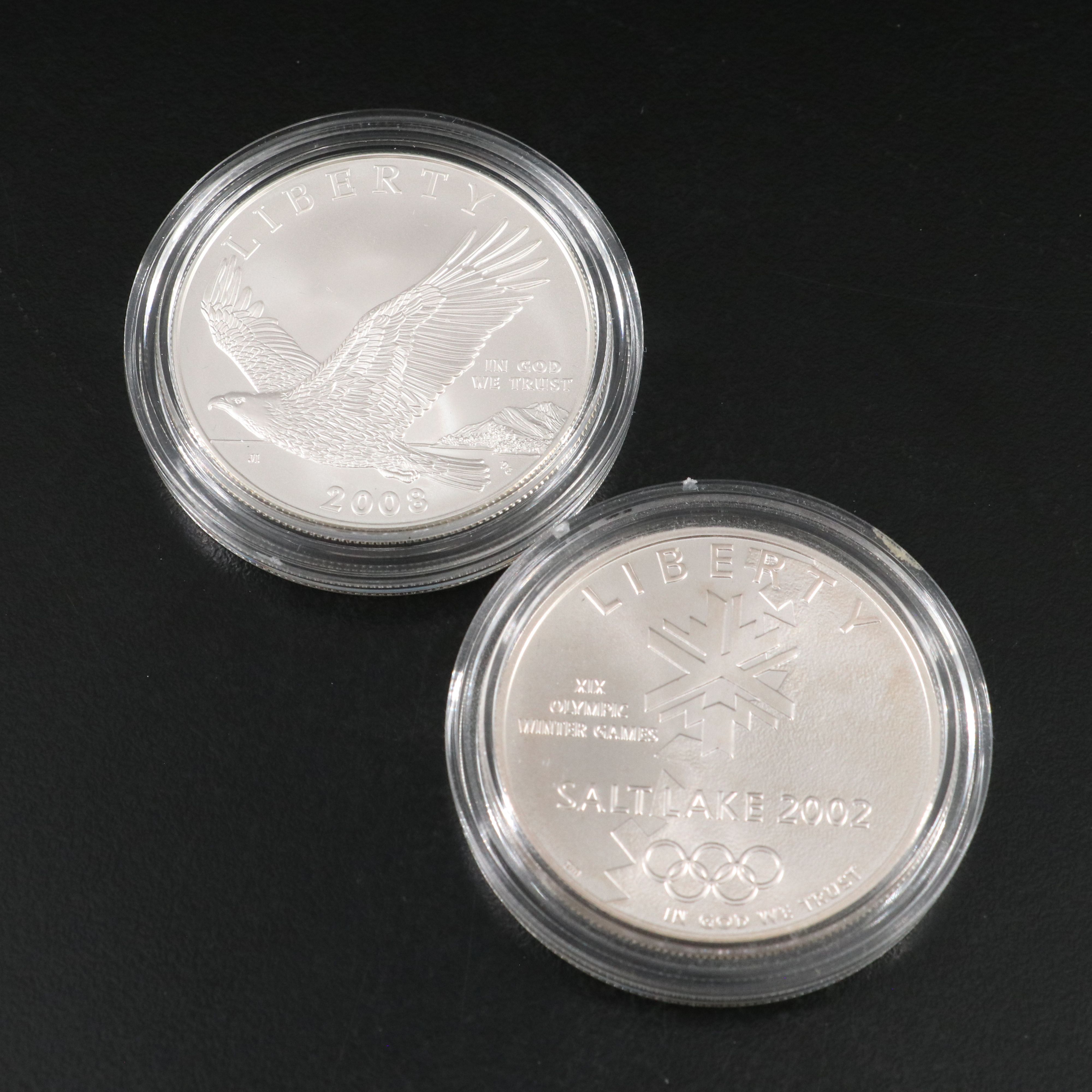 Four Modern Commemorative Uncirculated U.S. Silver Dollars