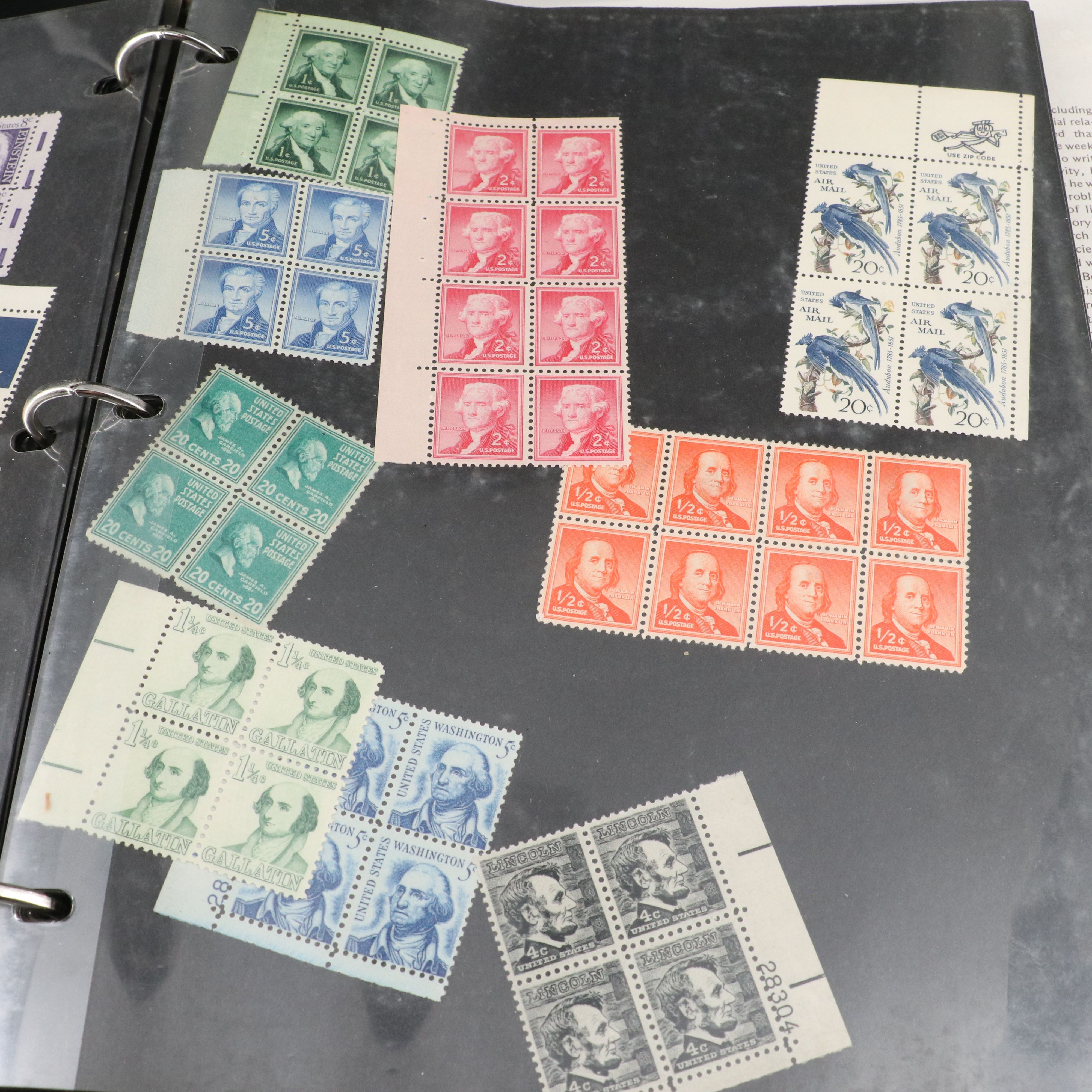 Four Notebooks with Unused United States Stamps