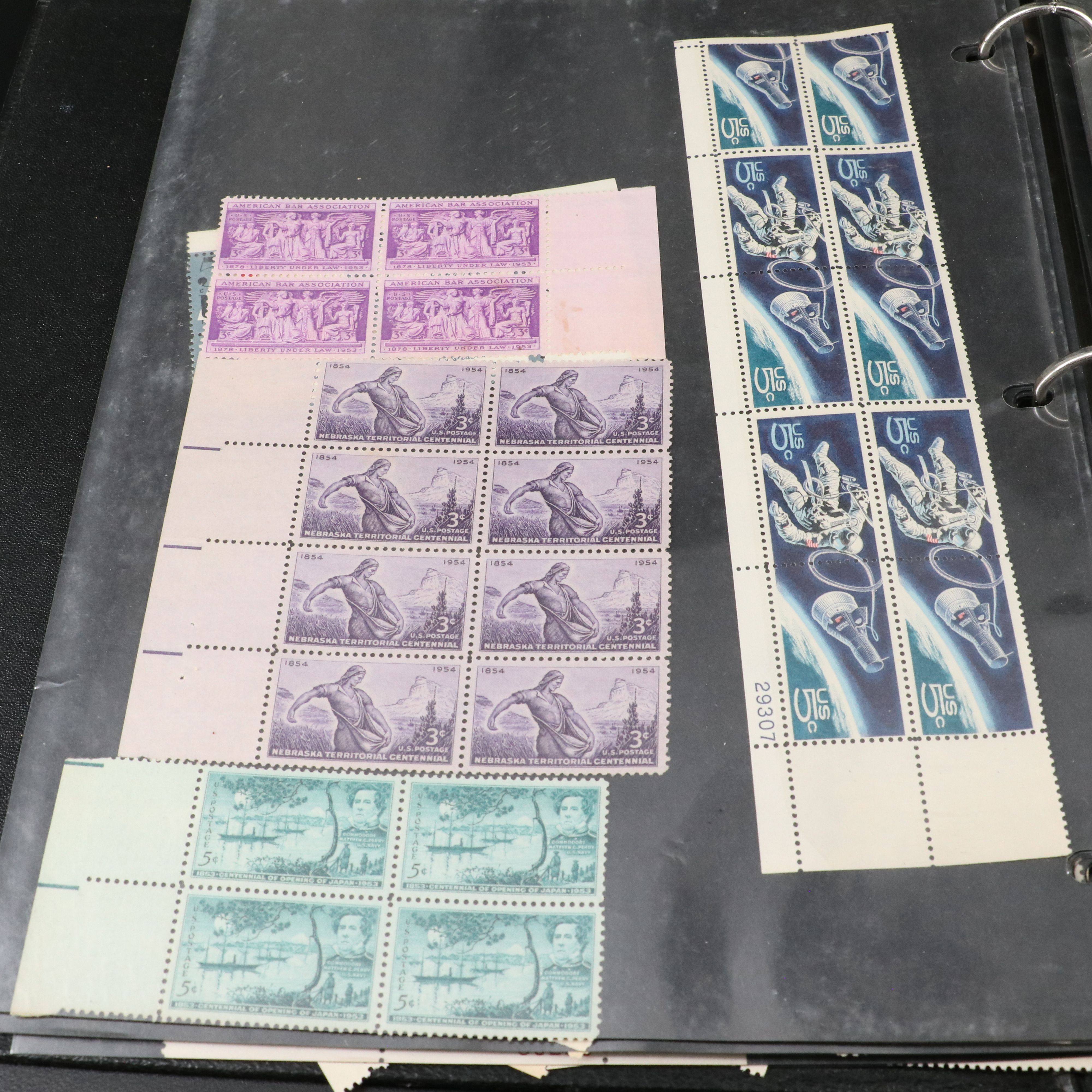 Four Notebooks with Unused United States Stamps