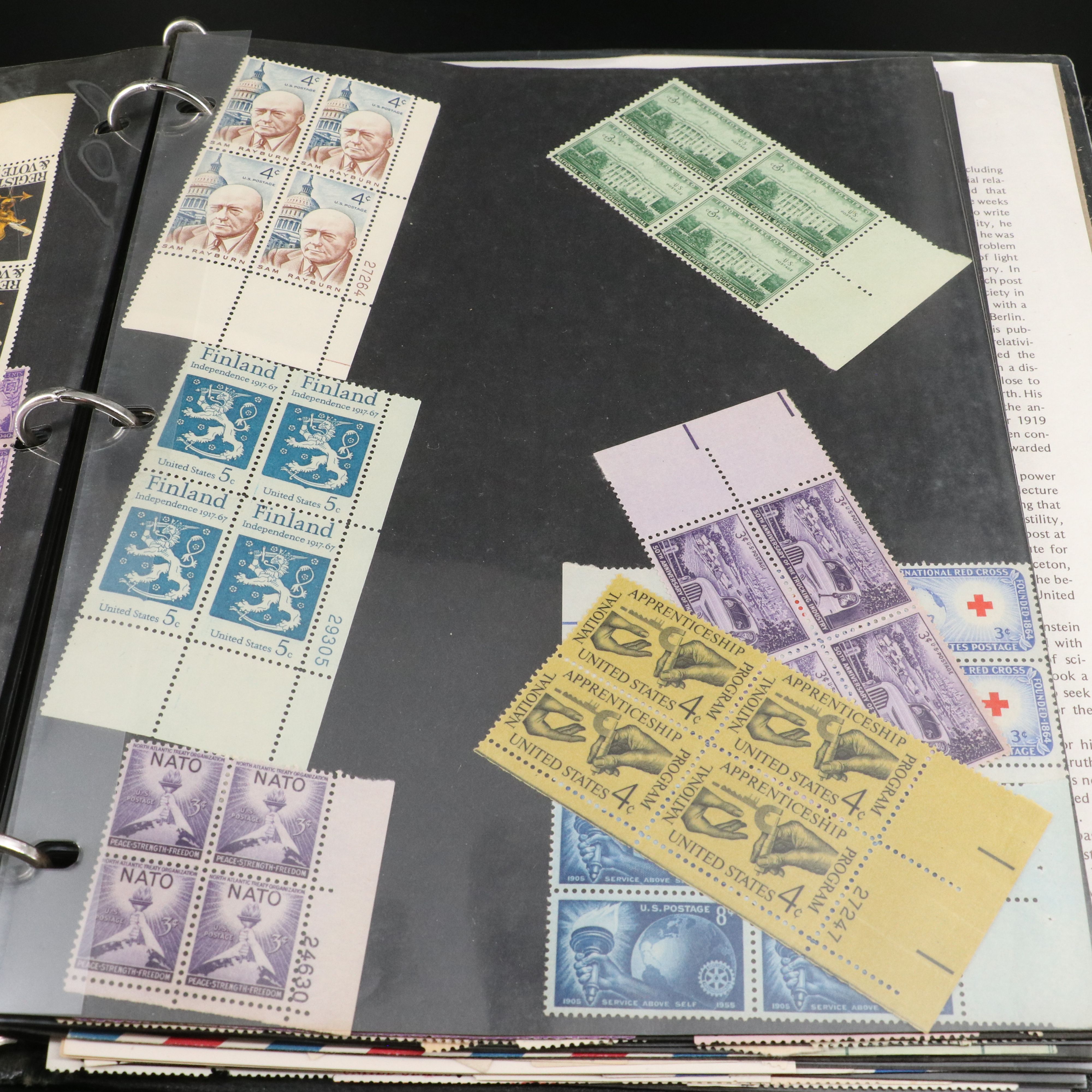 Four Notebooks with Unused United States Stamps