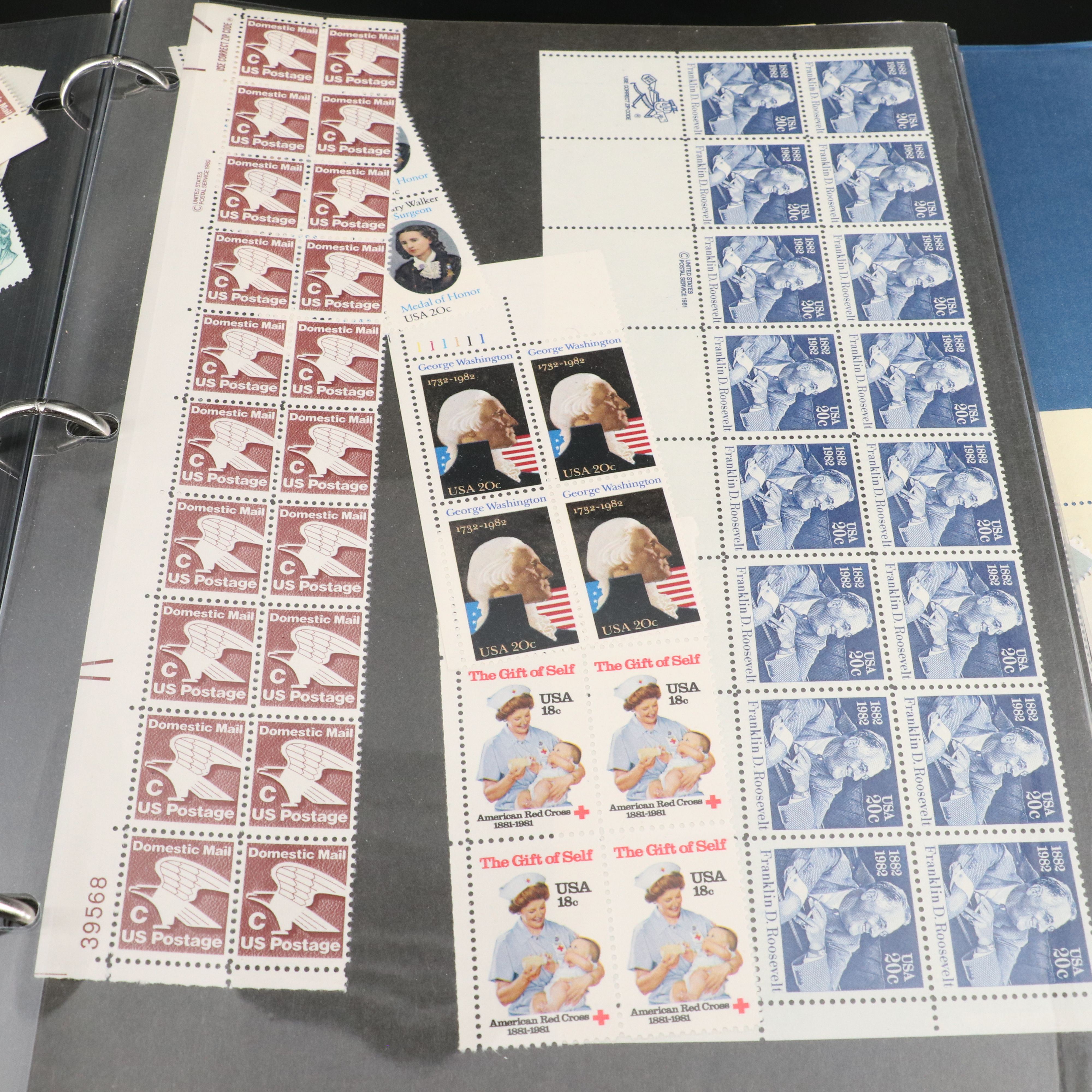 Four Notebooks with Unused United States Stamps