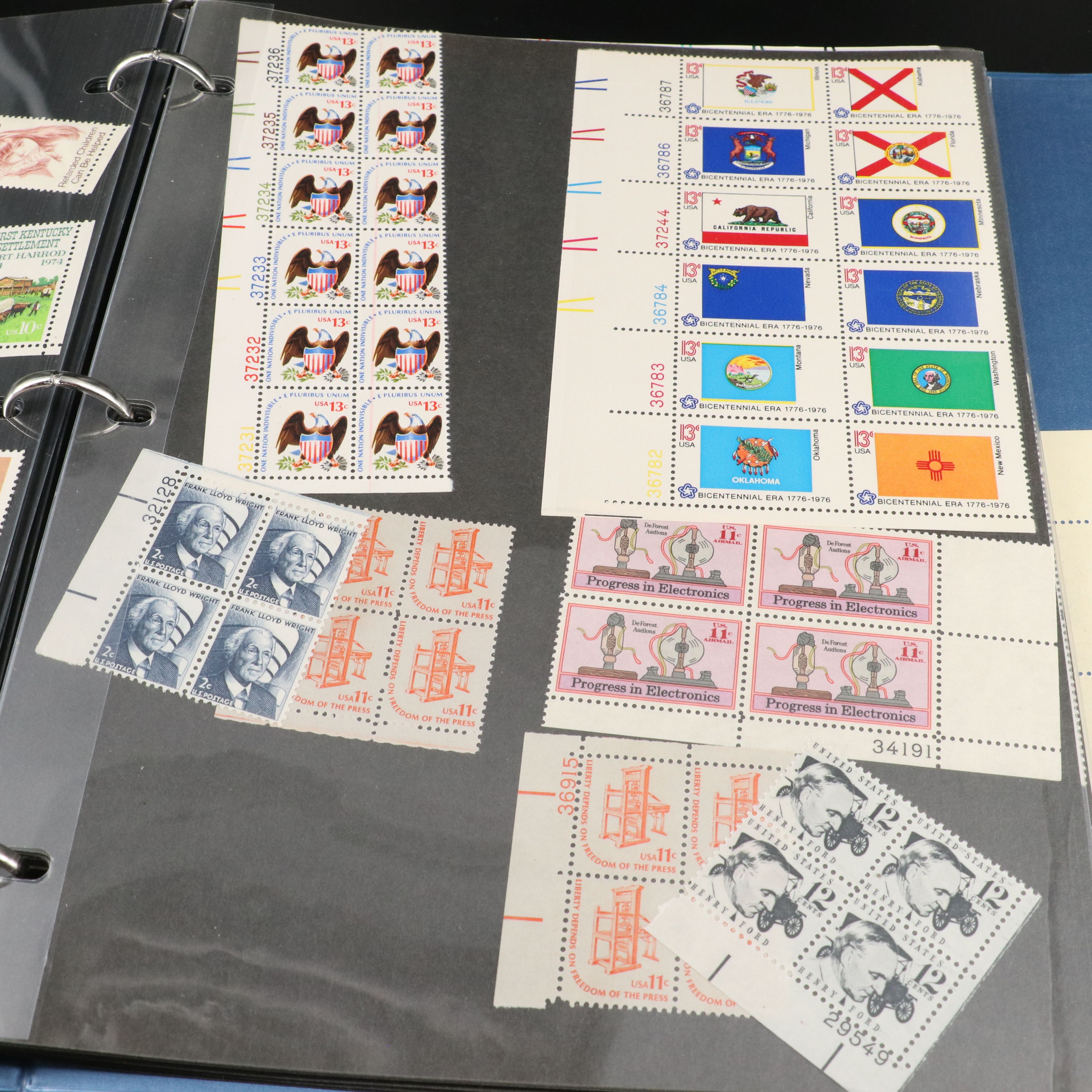 Four Notebooks with Unused United States Stamps