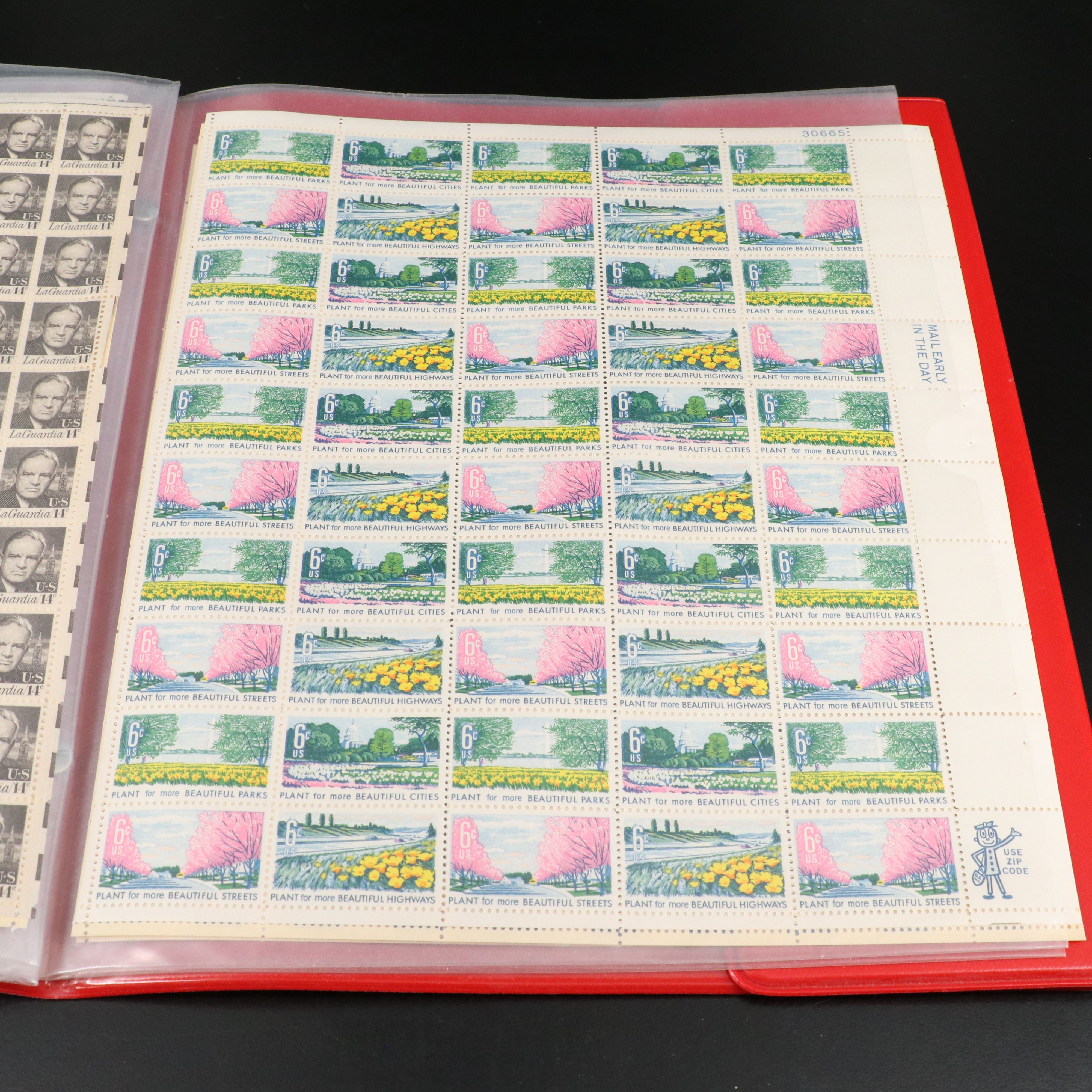 Four Notebooks with Unused United States Stamps