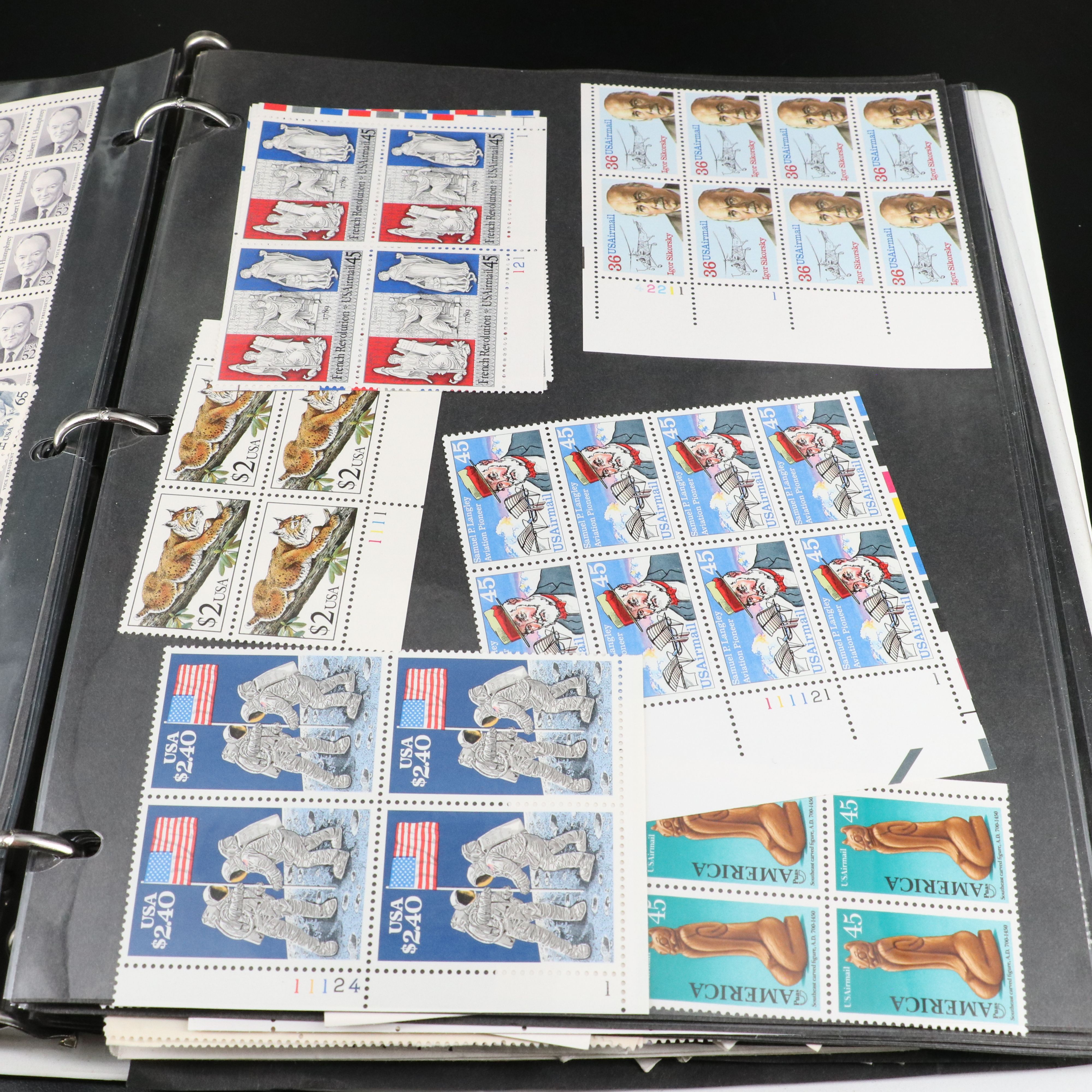 Four Notebooks with Unused United States Stamps