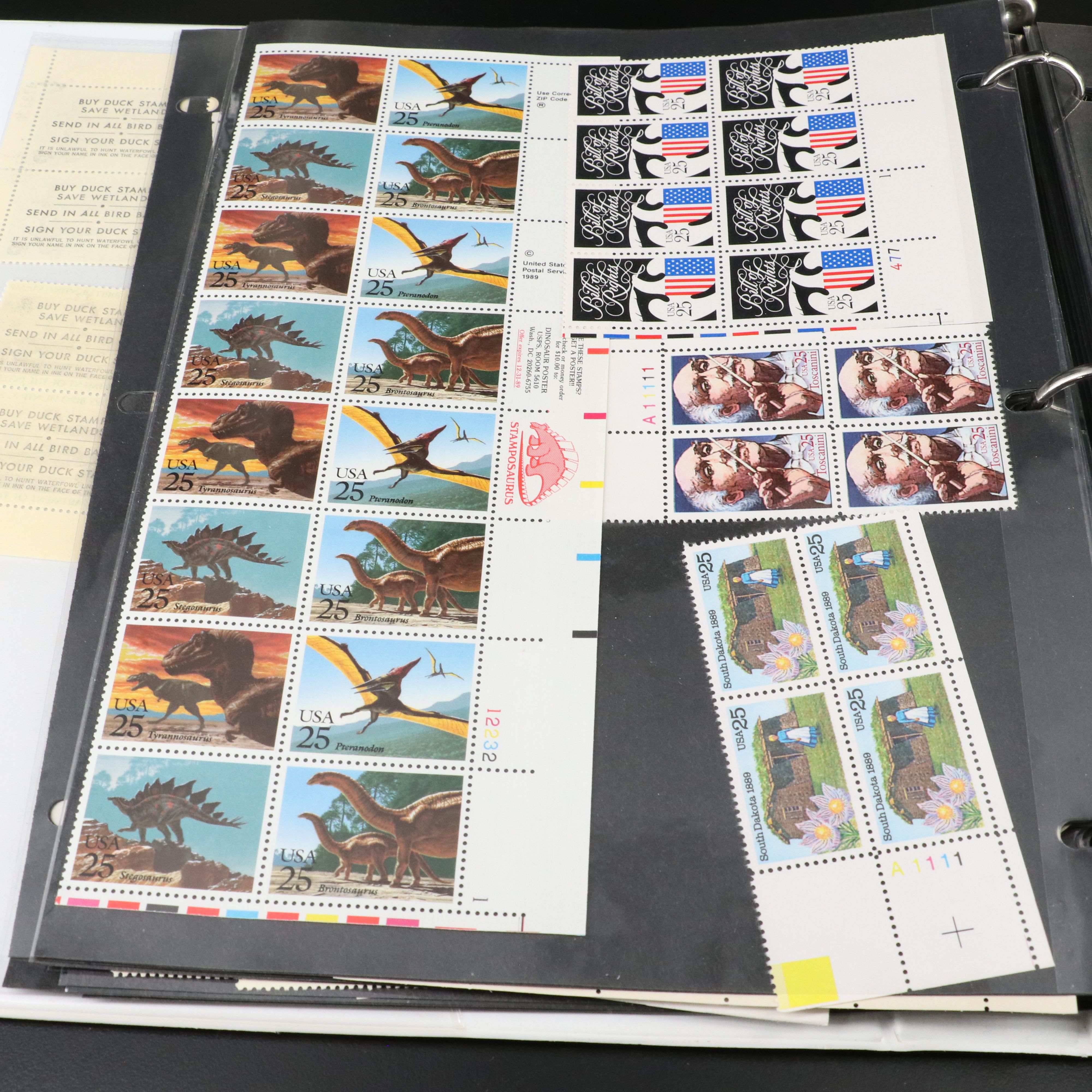 Four Notebooks with Unused United States Stamps