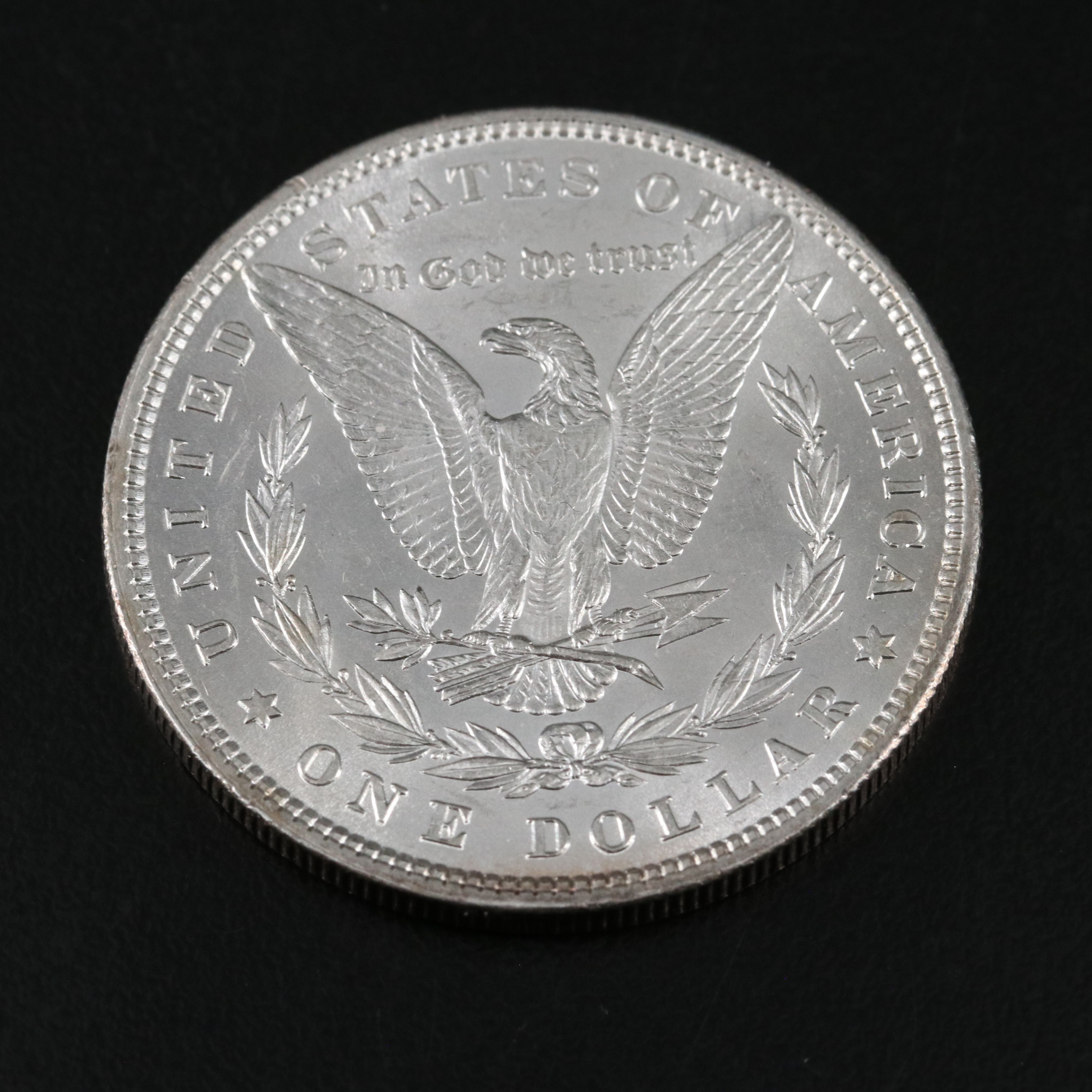1880 and Three 1884-O Morgan Silver Dollars