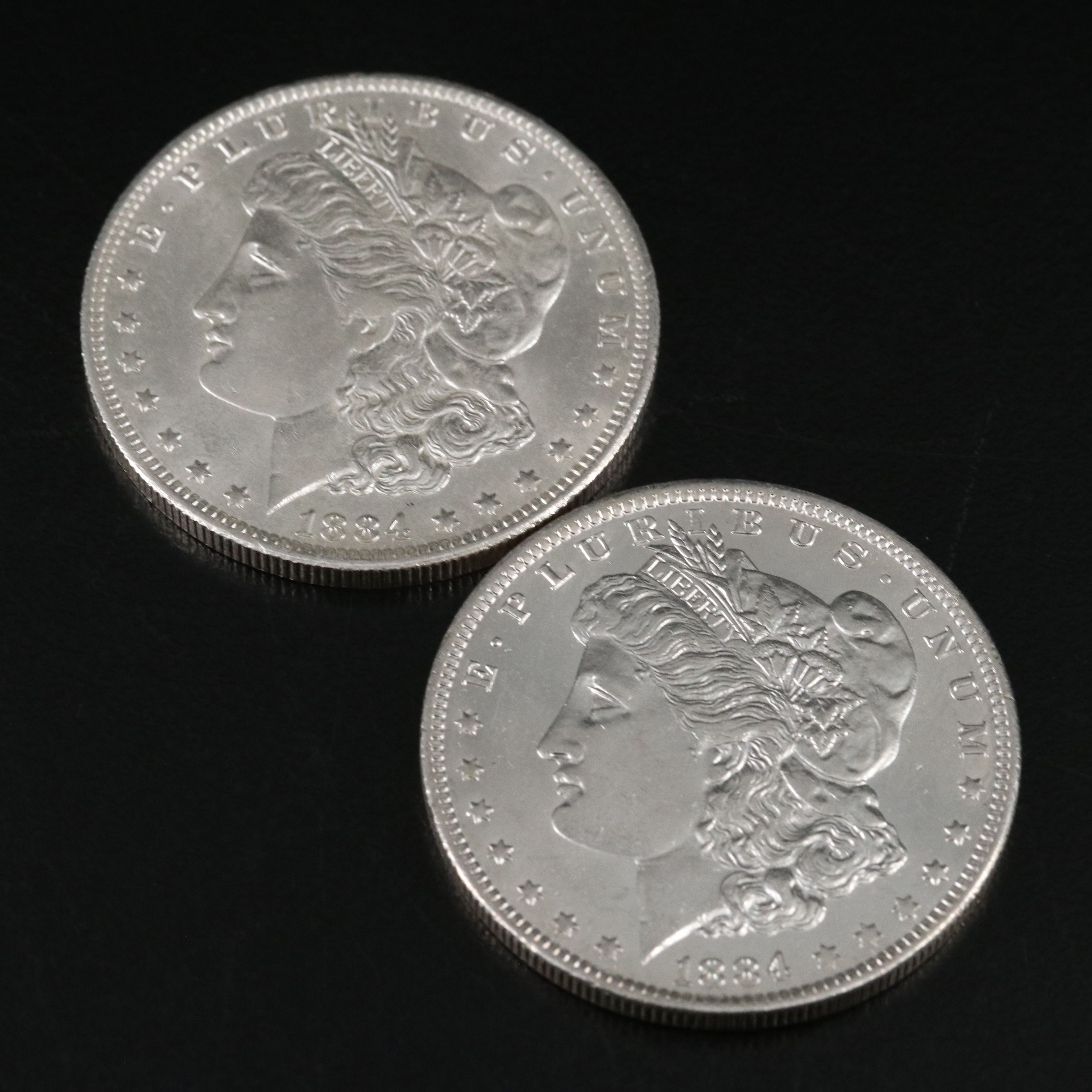 1880 and Three 1884-O Morgan Silver Dollars