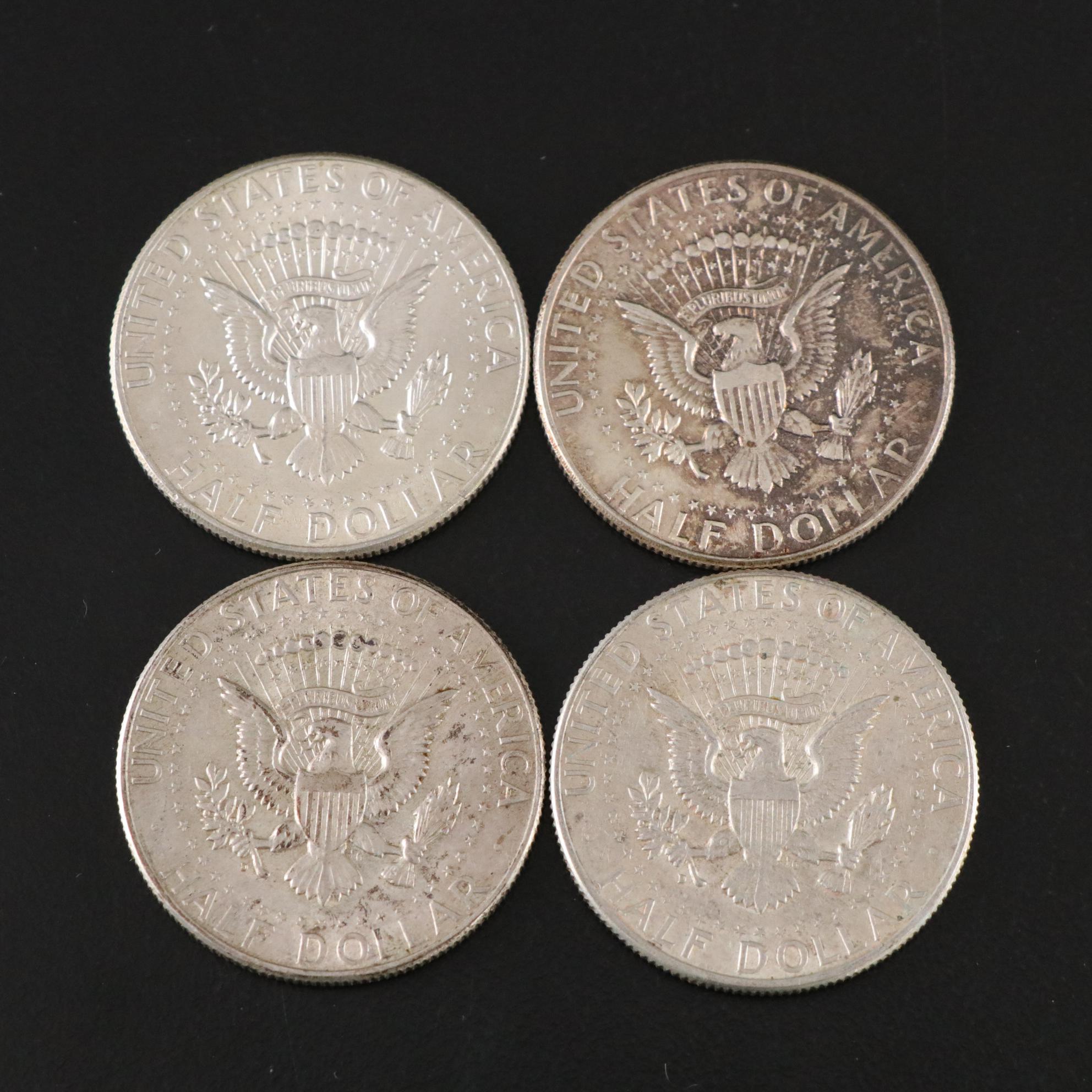 Fifteen Franklin Half Dollars and Four 1964 Kennedy Silver Half Dollars
