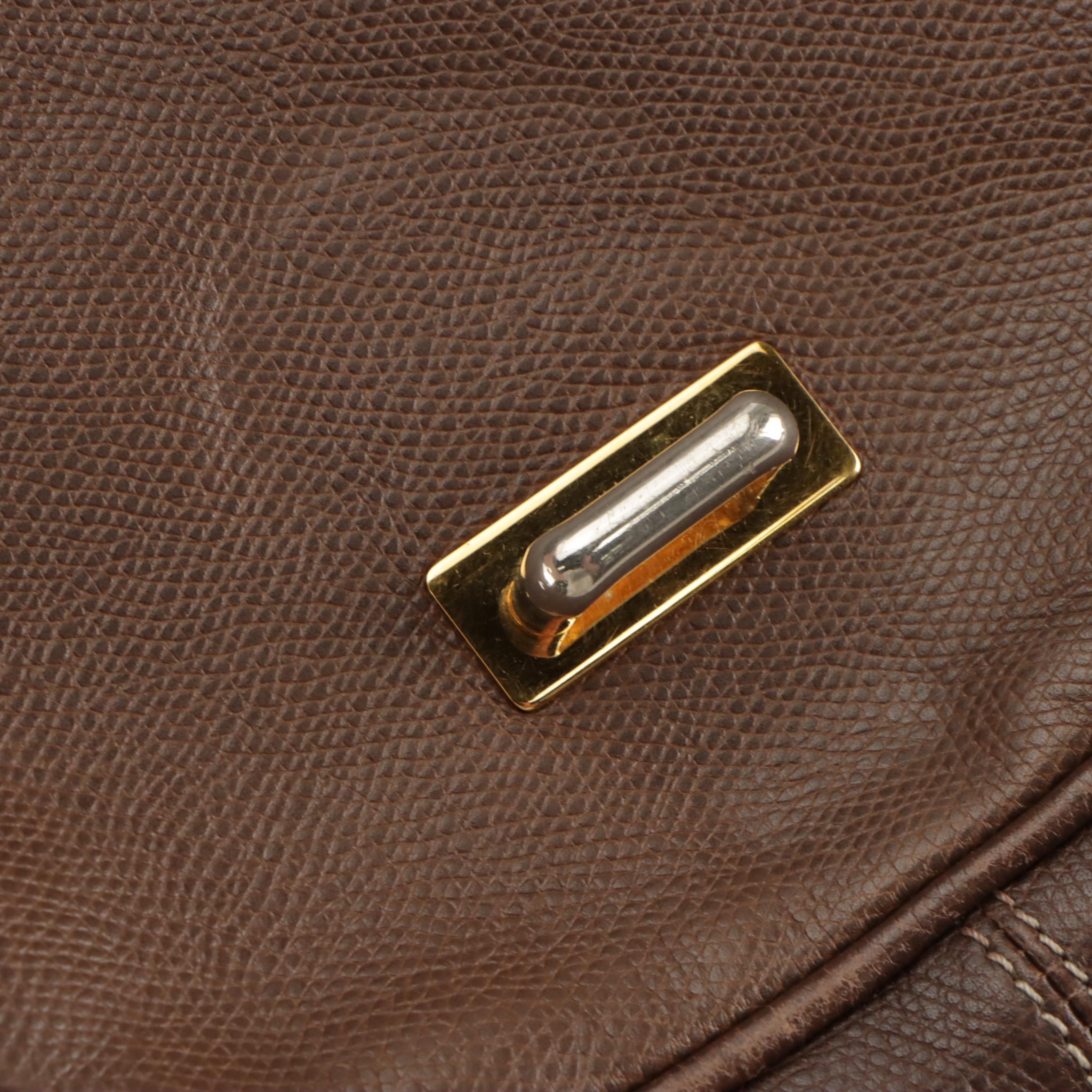 Loewe Vintage Anagram Embossed Crossbody Saddle Bag in Brown Leather, With Box