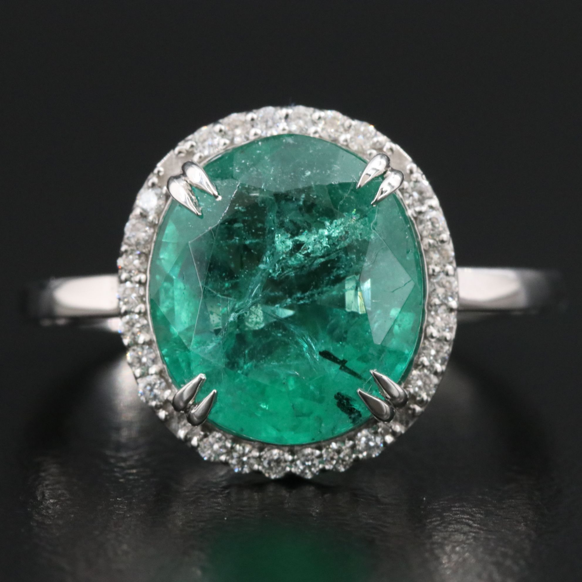 Platinum 4.49 CT Emerald and 0.16 CTW Diamond Ring