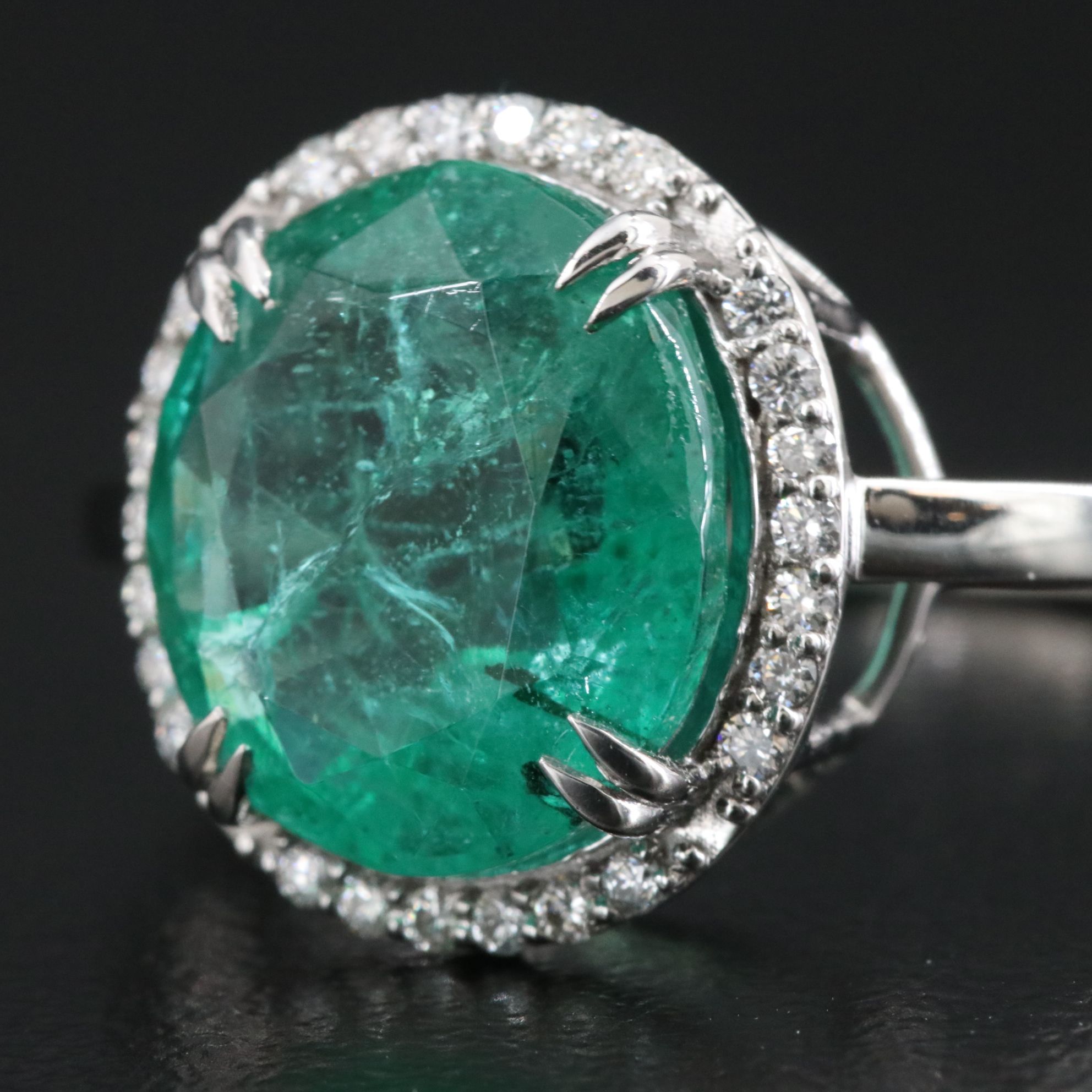 Platinum 4.49 CT Emerald and 0.16 CTW Diamond Ring
