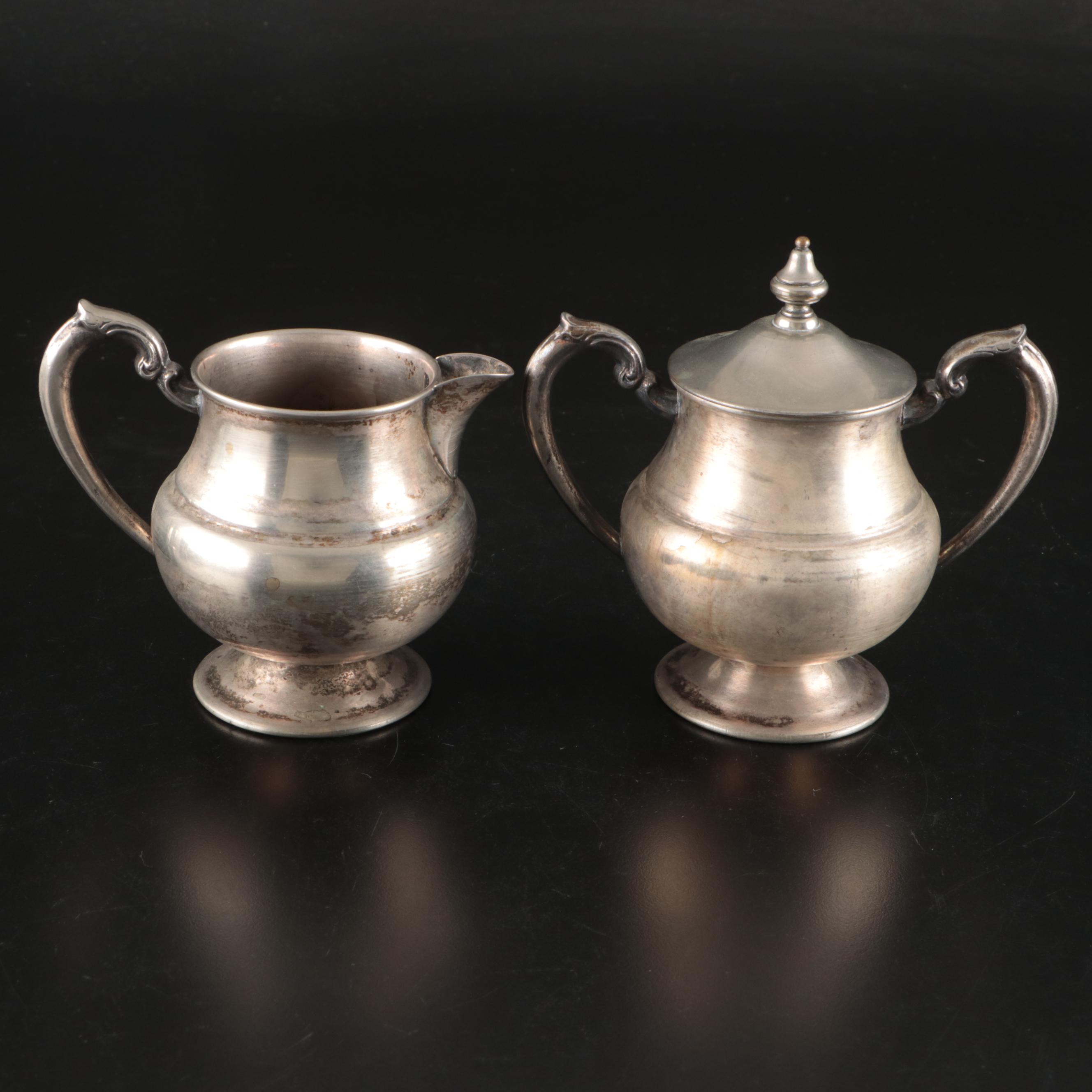 Silver Plate Teapot with Creamer, Sugar, and Shot Glasses with Other Pewter Ware