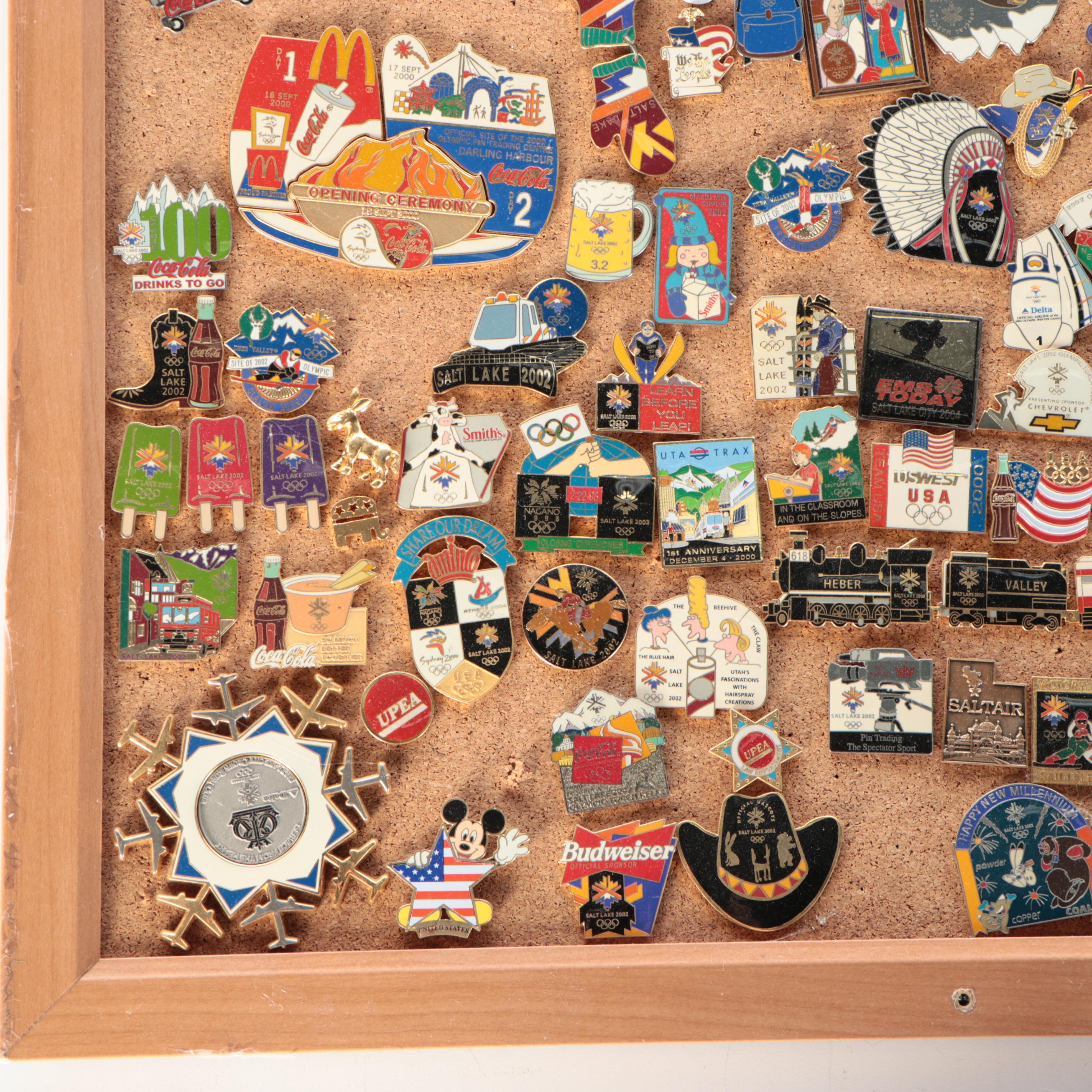 Vintage Olympic and Other Themed Enamel Pinback Collection on Cork Board