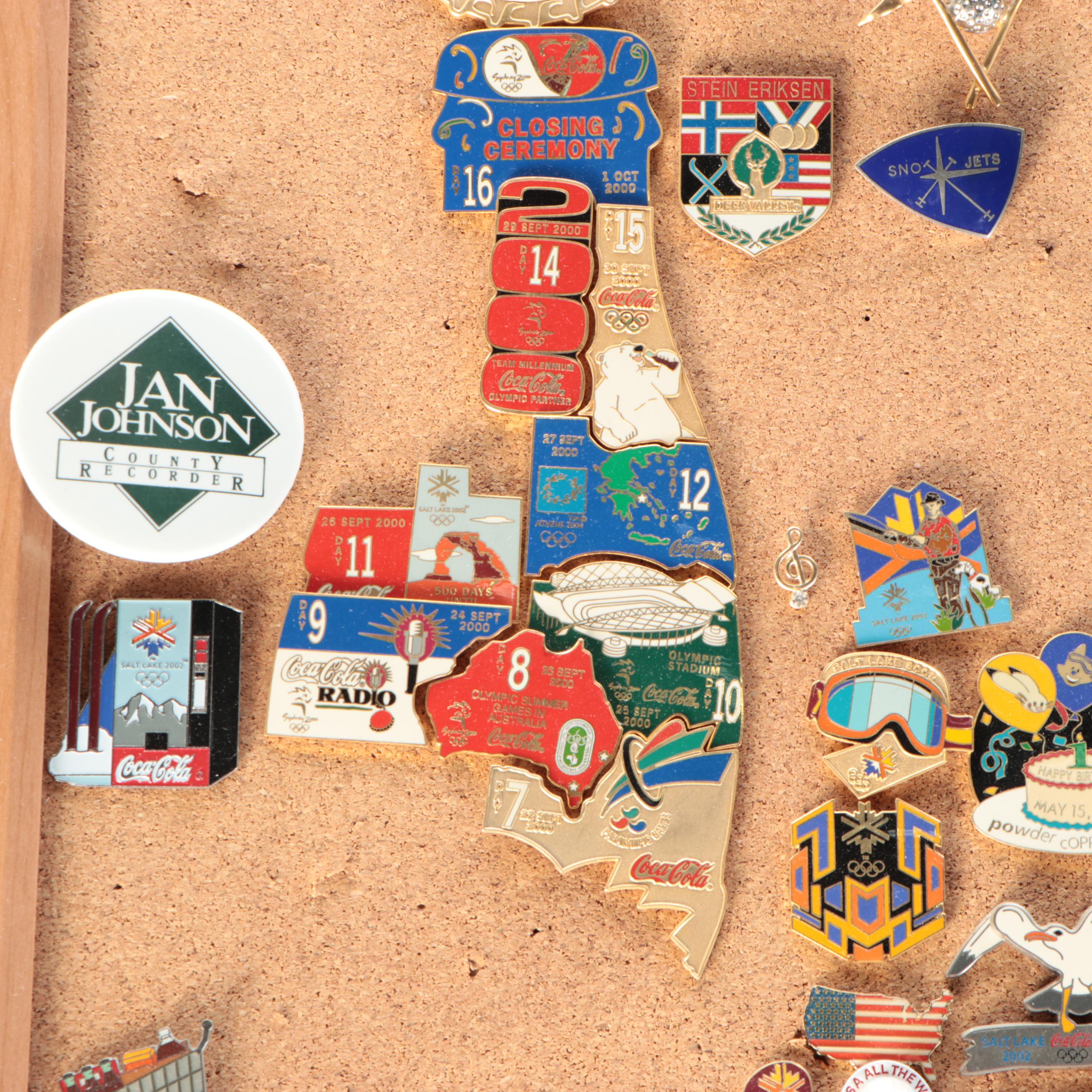 Vintage Olympic and Other Themed Enamel Pinback Collection on Cork Board