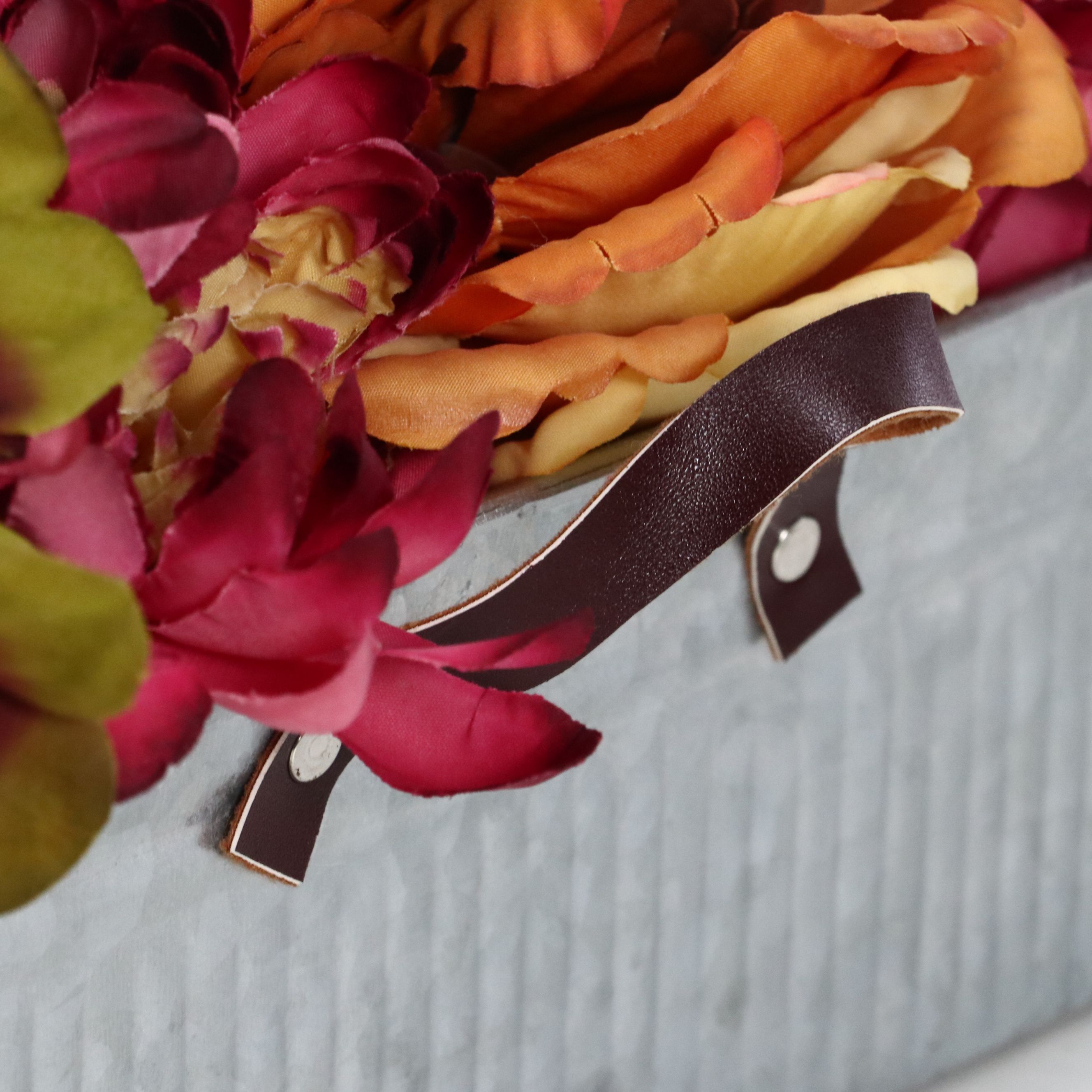 Rustic Farmhouse Style Artificial Flowers with Metal Chicken Trough and Stones