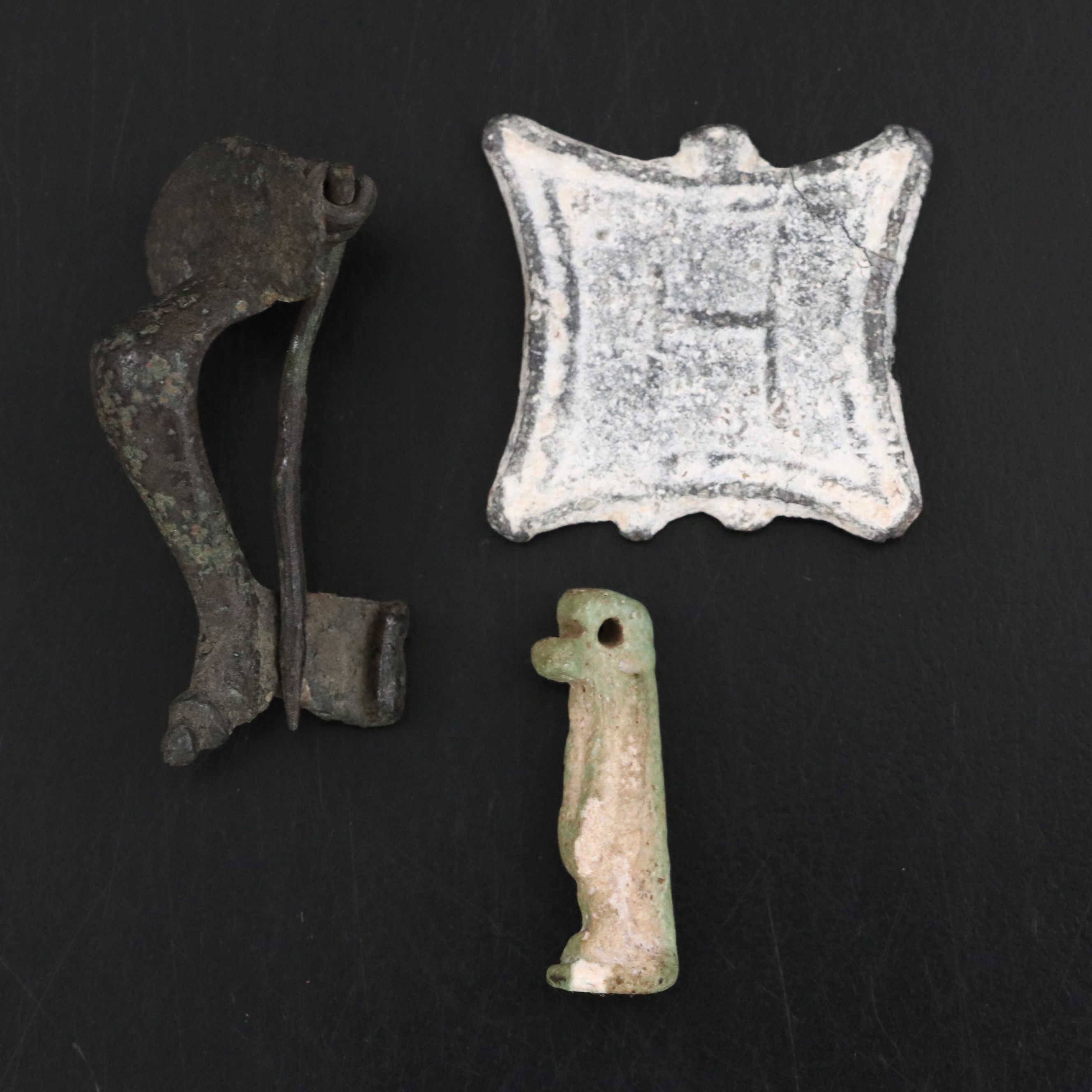 Roman Bronze Fibula, Byzantine Token and Egyptian Faience Amulet