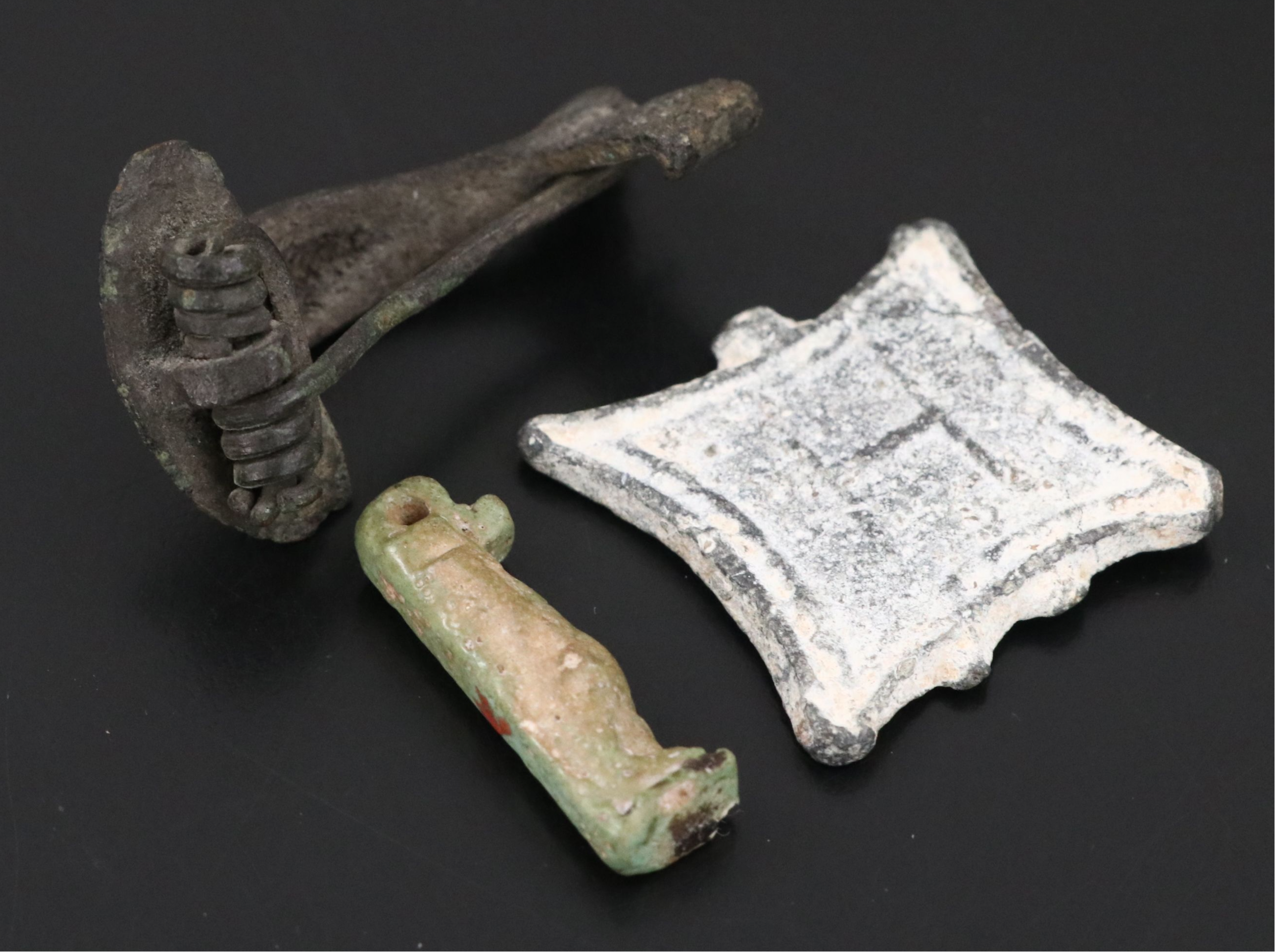 Roman Bronze Fibula, Byzantine Token and Egyptian Faience Amulet