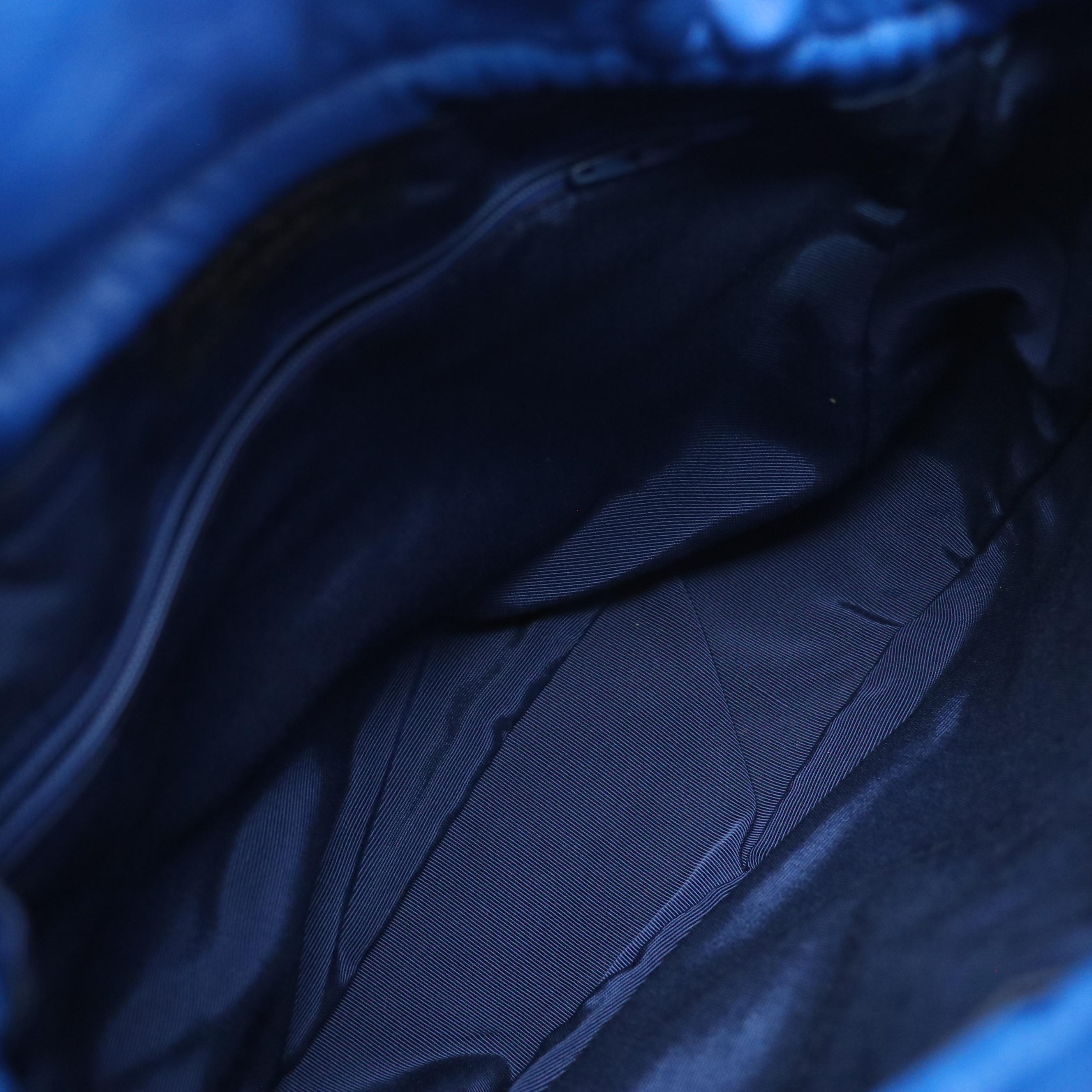 Yves Saint Laurent Studded Drawstring Bucket Crossbody Bag in Blue Leather