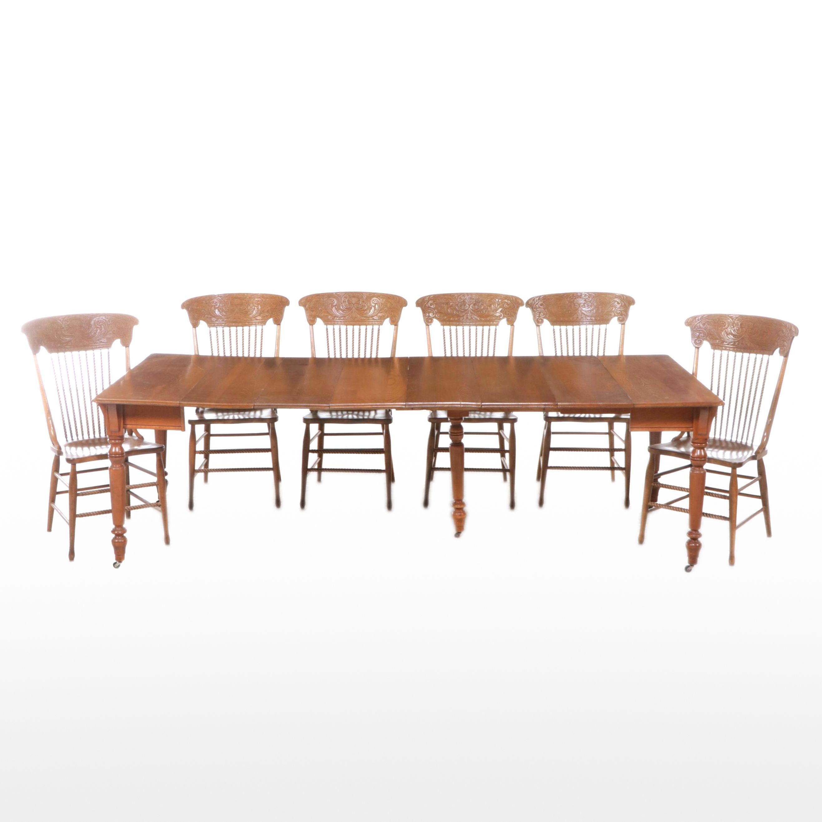 Seven Piece Oak Dining Set with Press Back Chairs