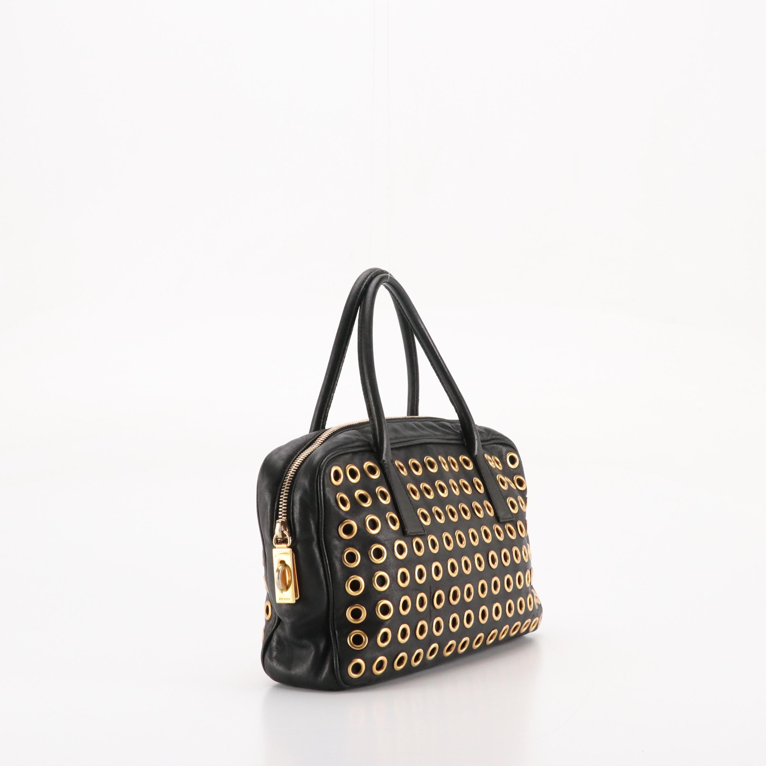 Prada Grommet Embellished Zip-Around Handbag in Black Nappa Leather