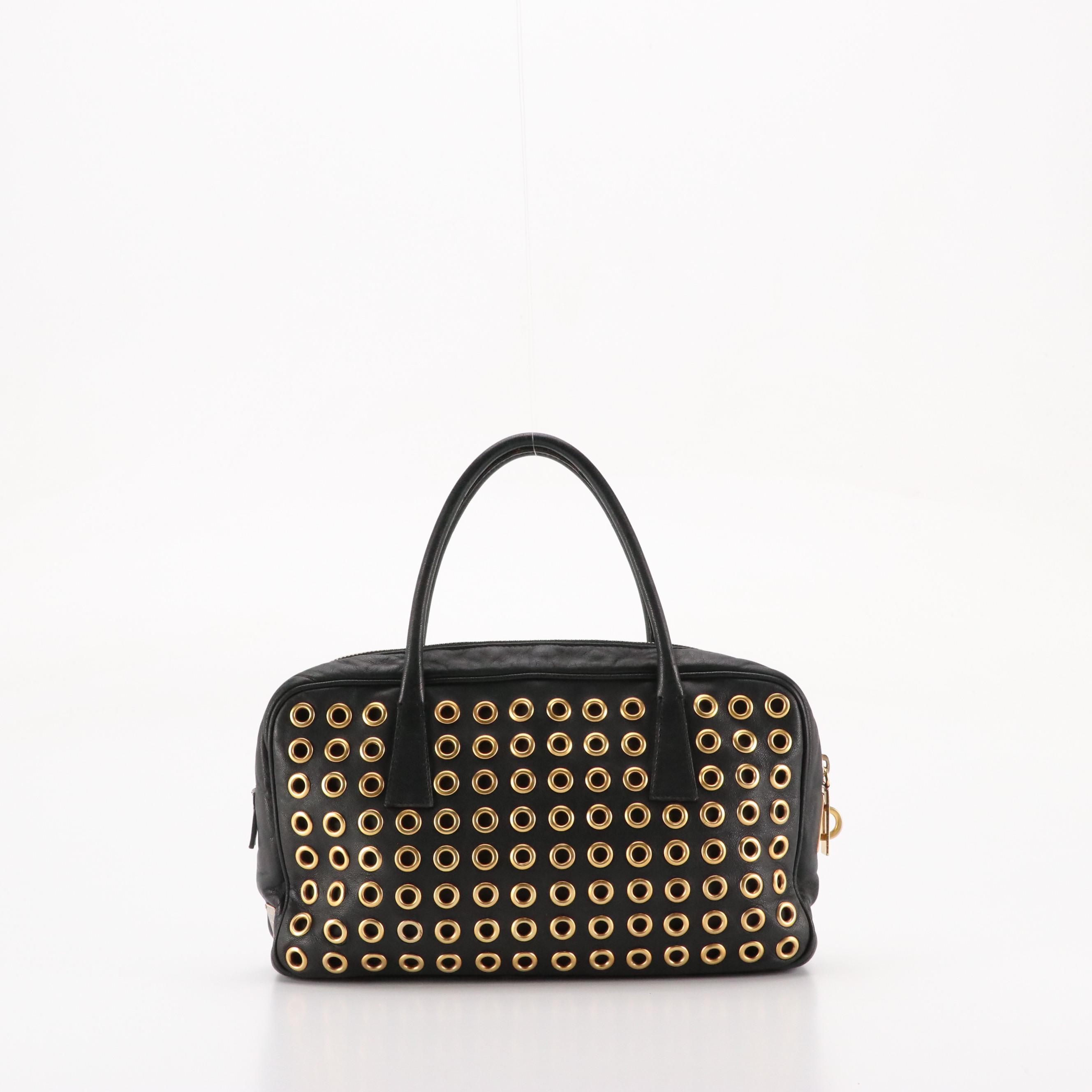 Prada Grommet Embellished Zip-Around Handbag in Black Nappa Leather