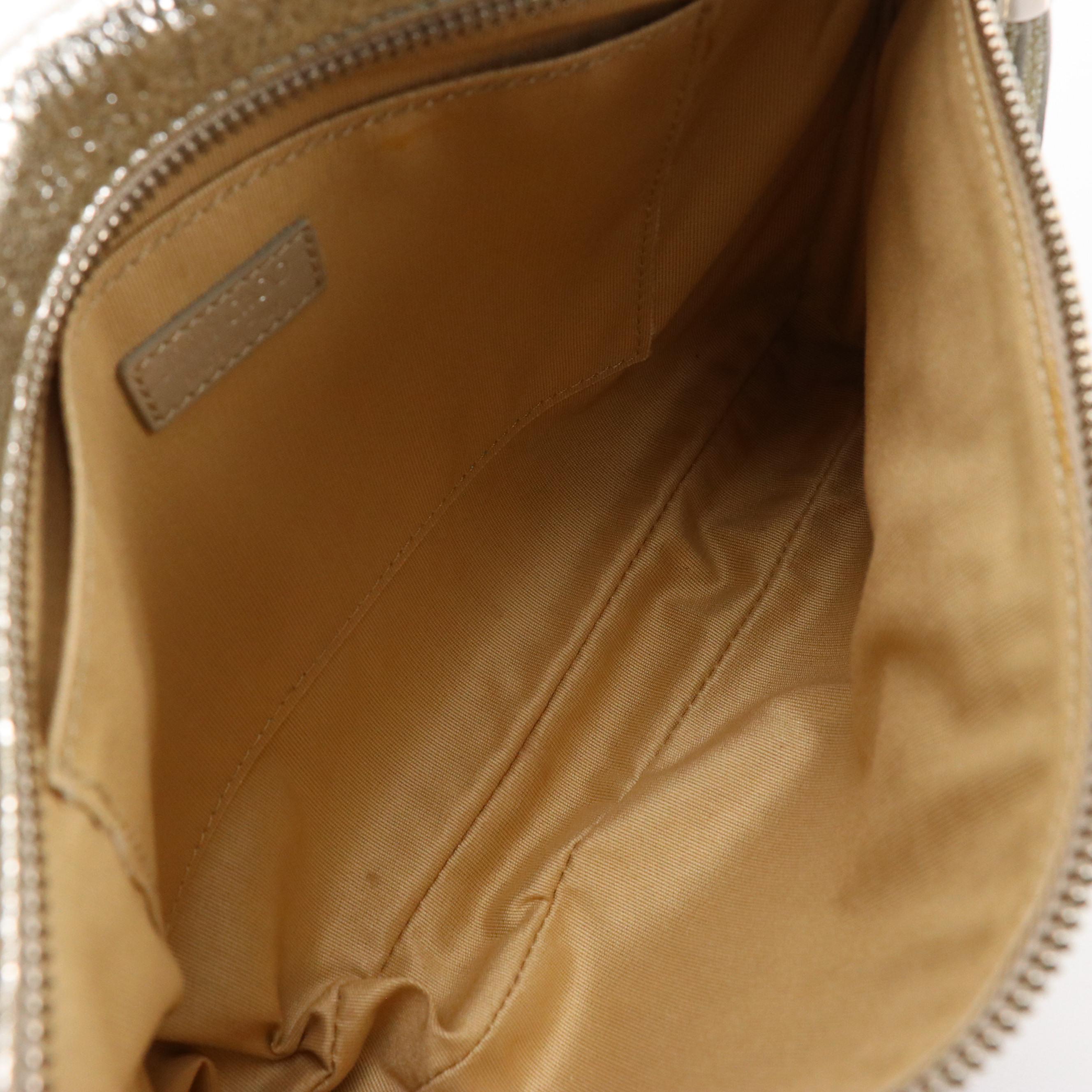 Jimmy Choo Zena Clutch in Silver Tone Star Studded Metallic Silver Leather