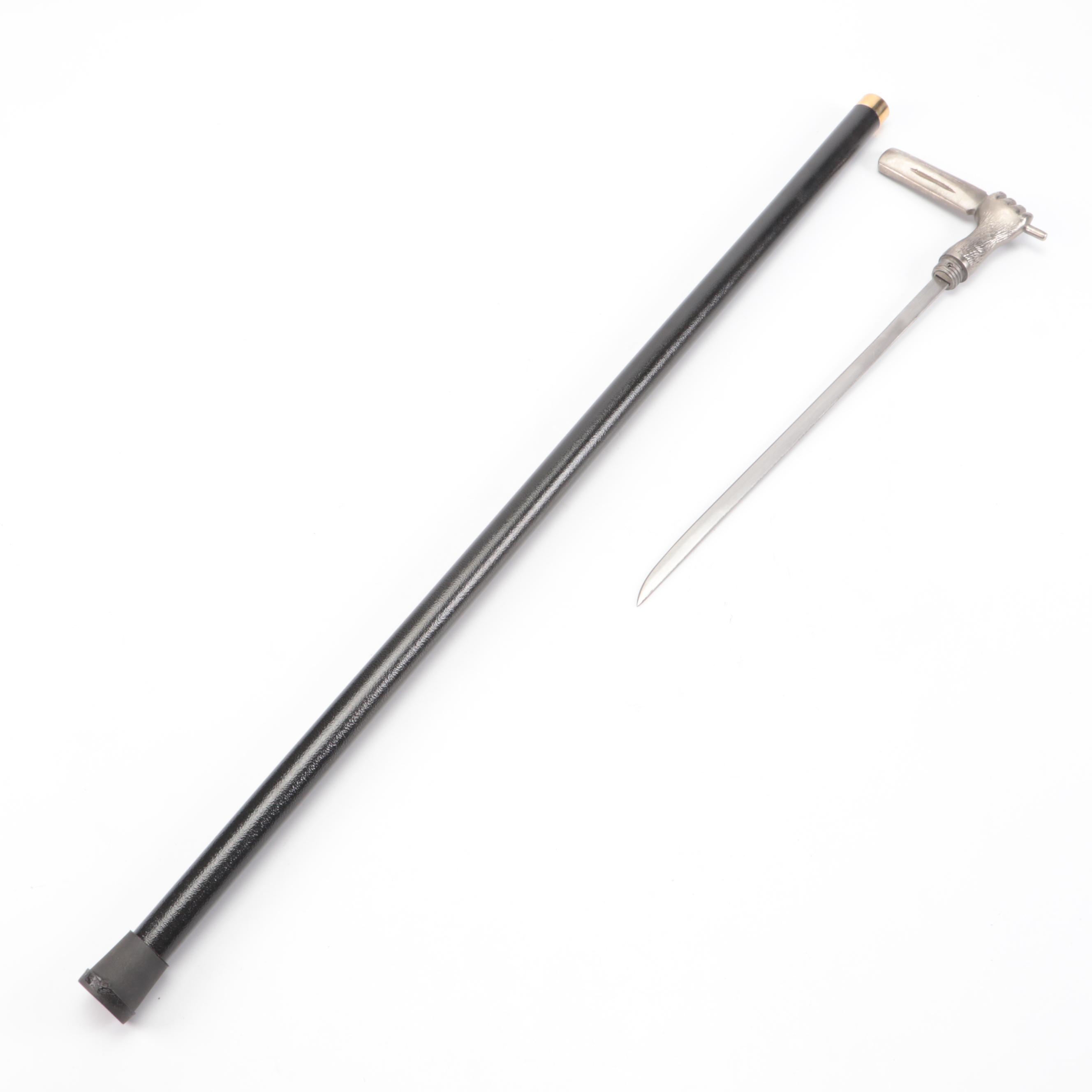 Hand Holding Paddle Handled Sword Cane