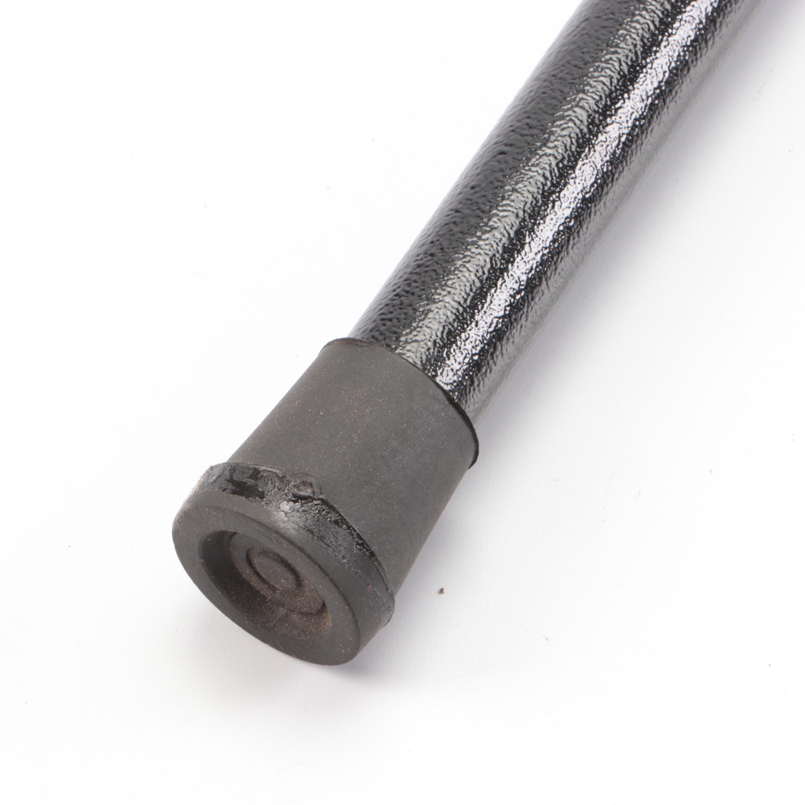 Hand Holding Paddle Handled Sword Cane