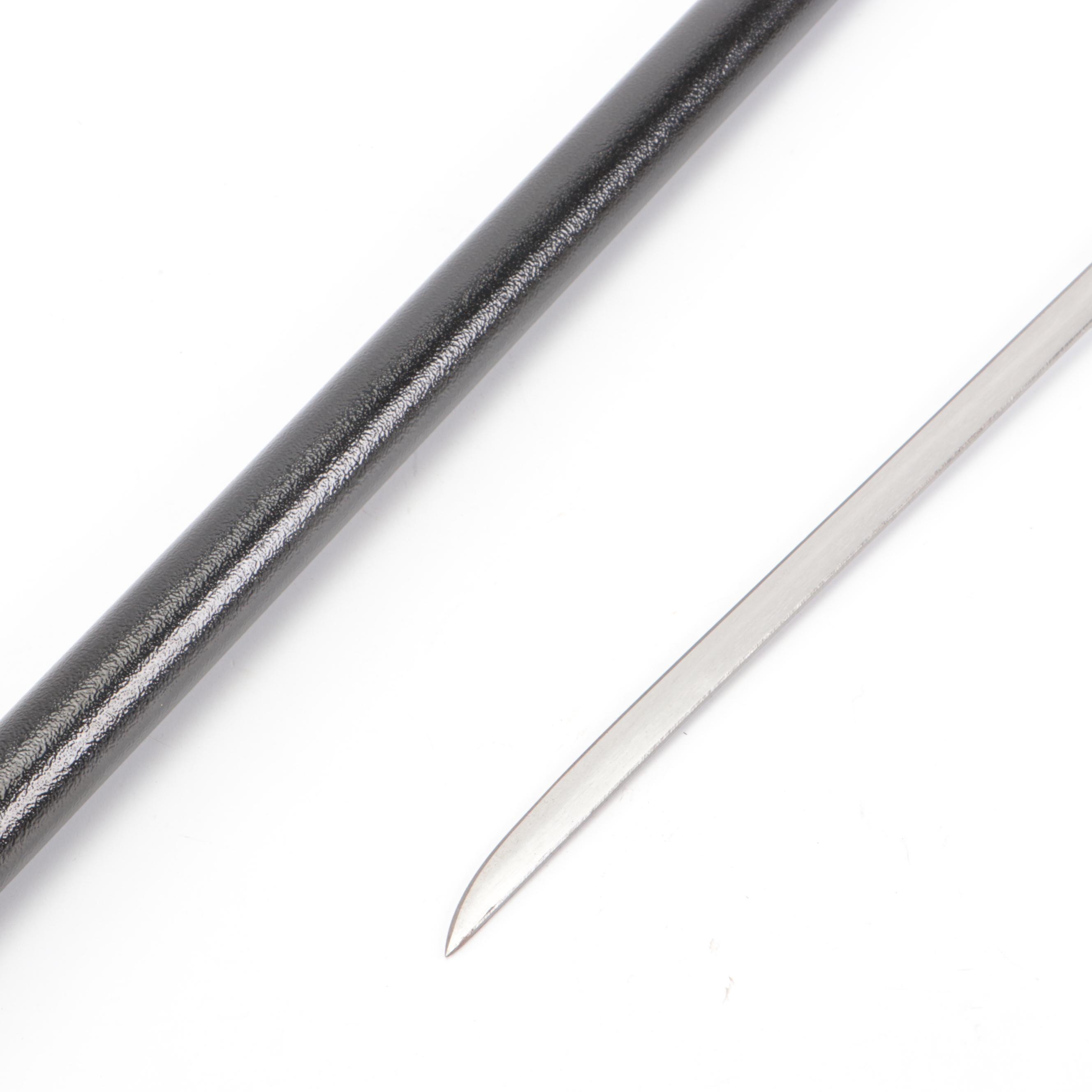 Hand Holding Paddle Handled Sword Cane