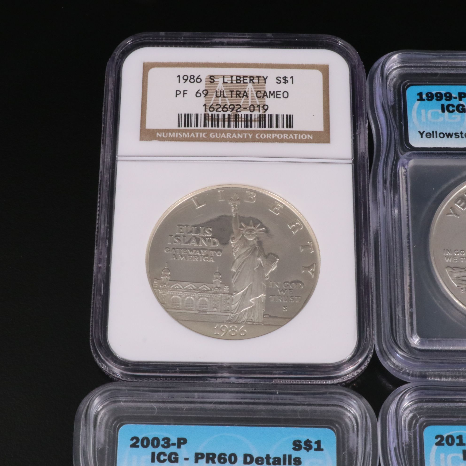 Four Different Modern Commemorative Silver Dollars