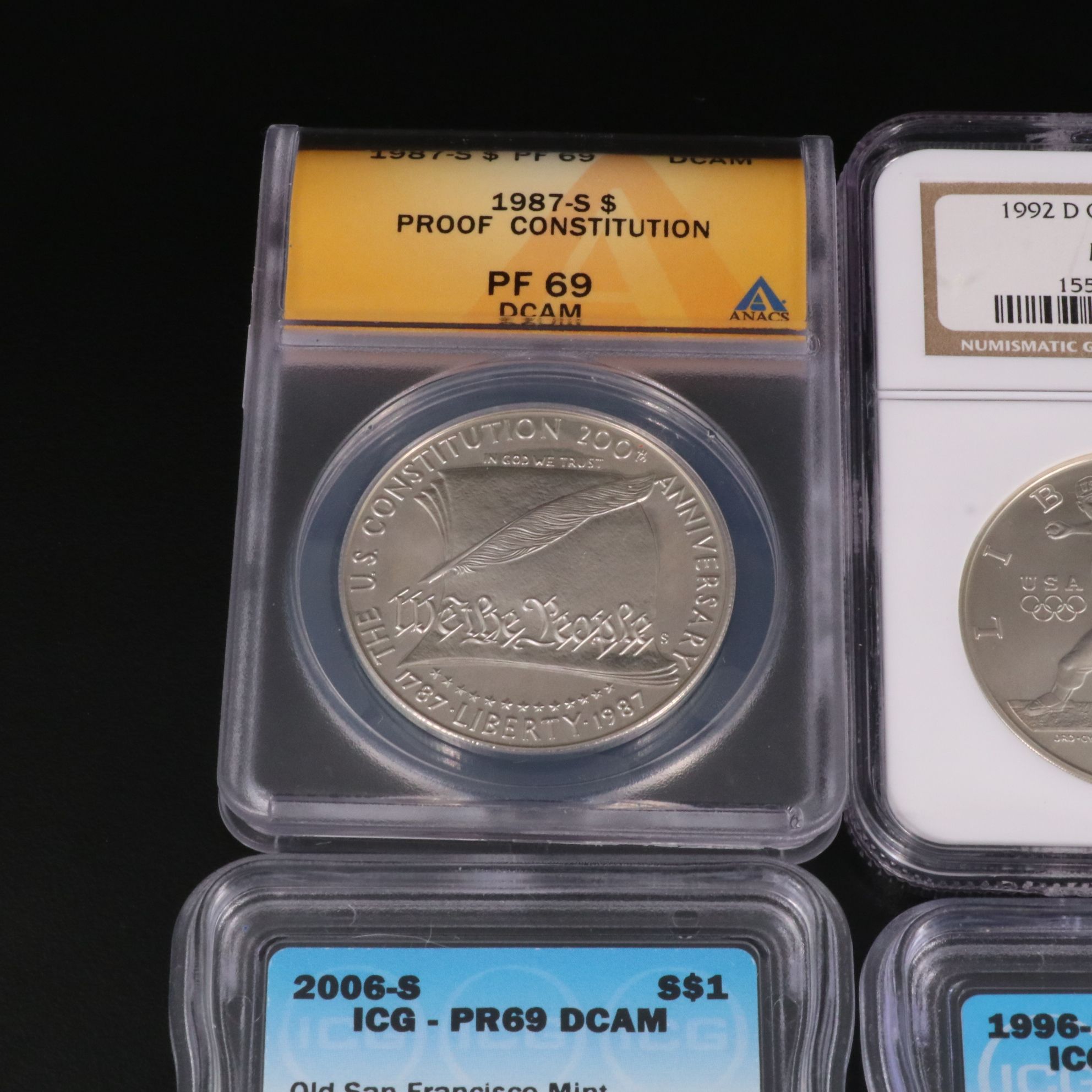 Four Modern Commemorative Silver Dollars