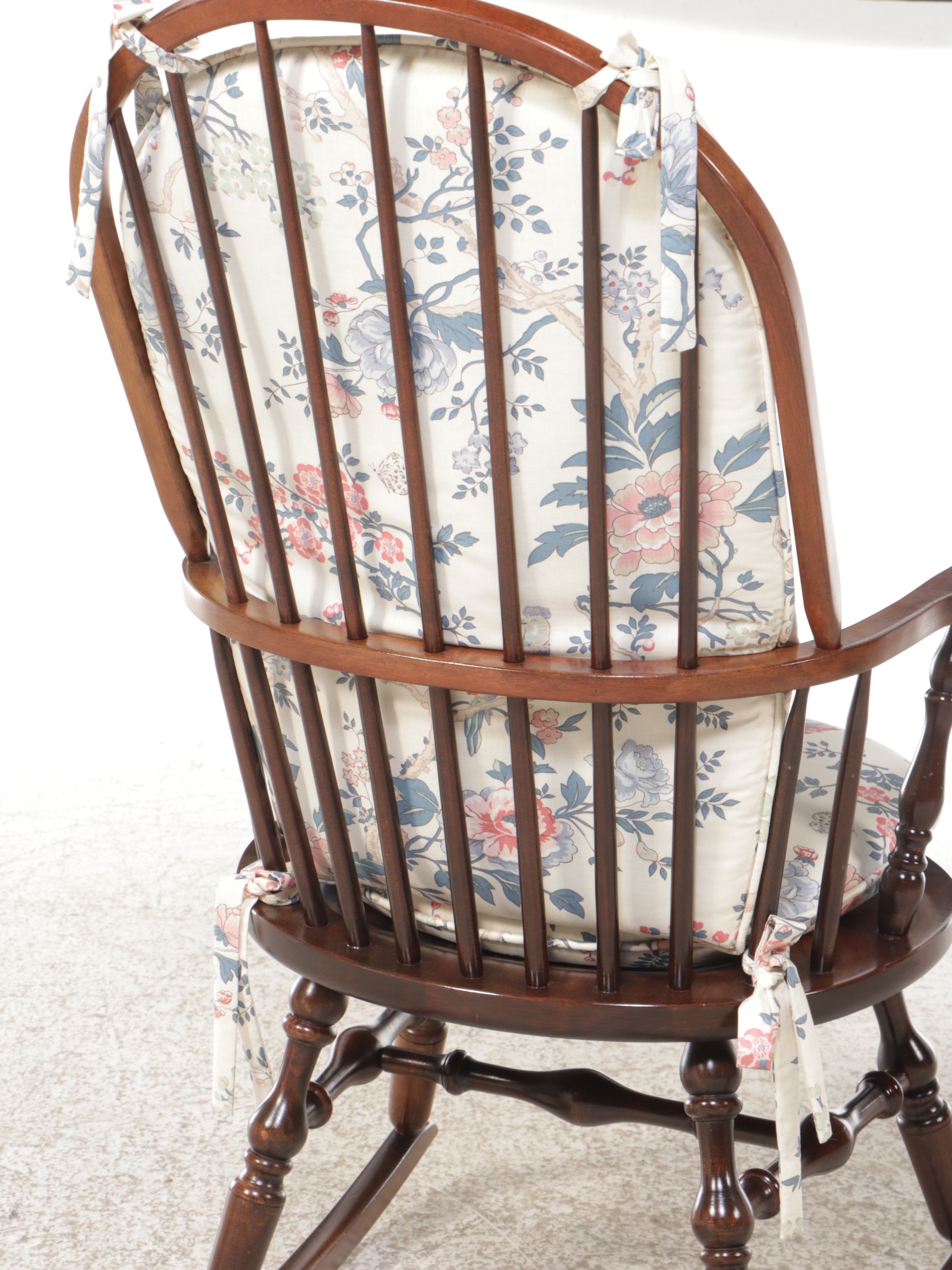 Turned Mahogany Wingback Rocking Chair with Floral Cushion