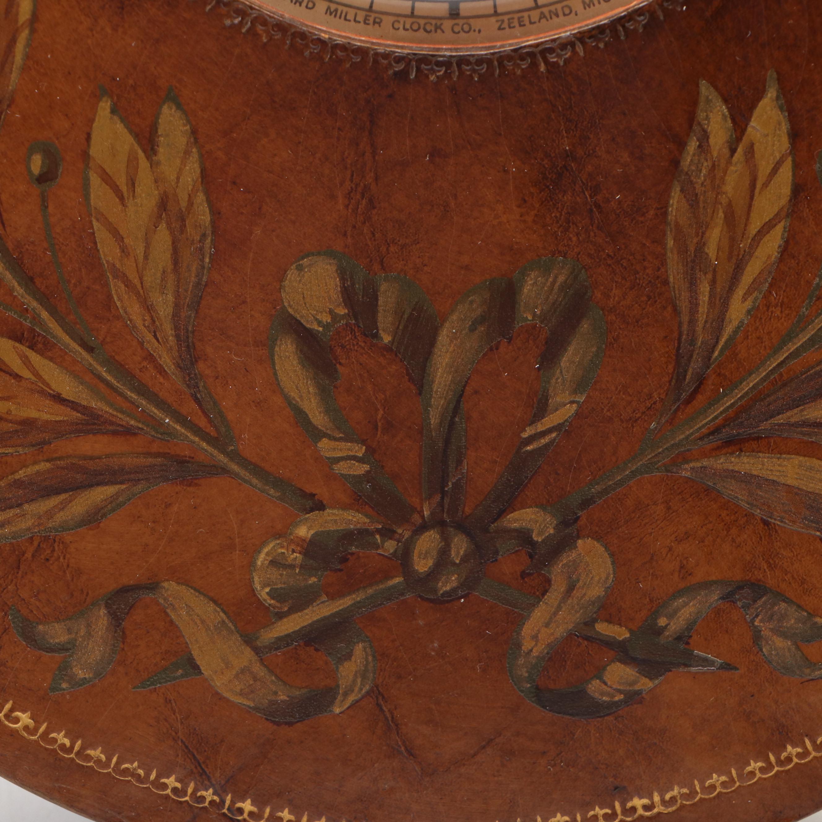 Howard Miller Laurel Motif Gilt Leather Wrapped Oval Wall Clock